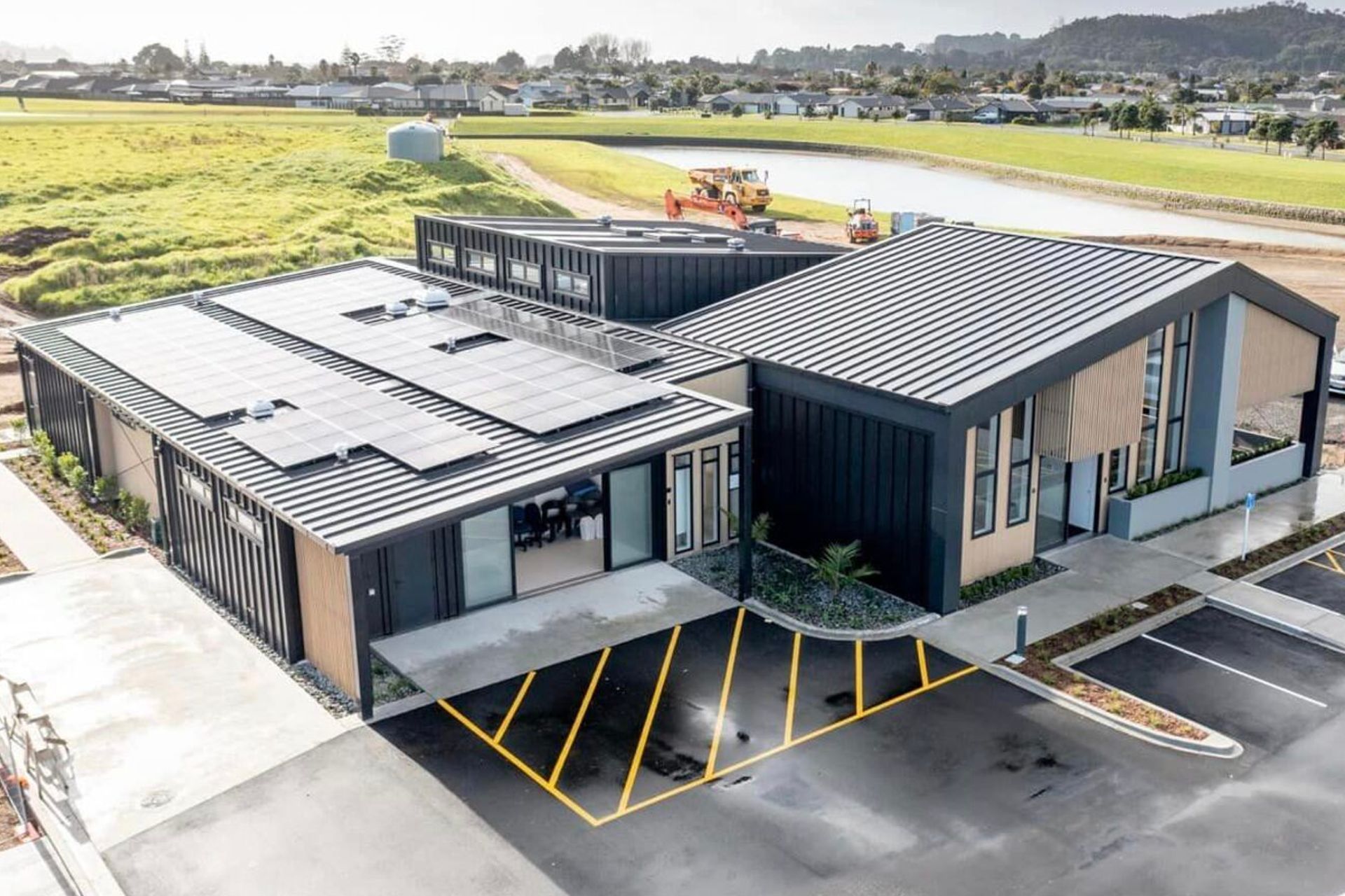Supply and Installation of Eurostyle Spanlok 45 0.55 450 Nominal Pan (455 cover) Maxx “Flaxpod” roofing and cladding.             Photo Credit Erica Kurth Photography