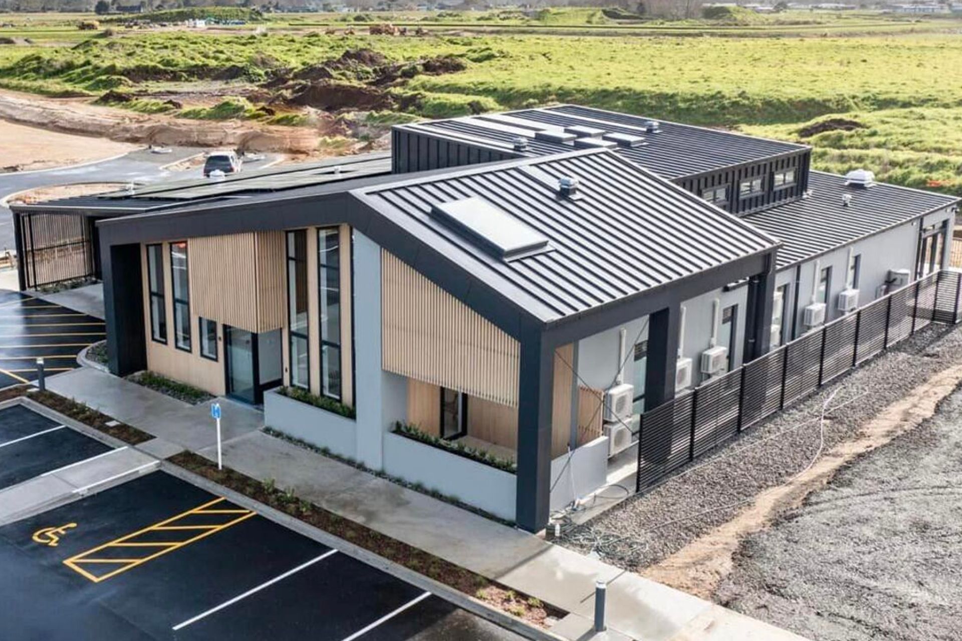 Supply and Installation of Eurostyle Spanlok 45 0.55 450 Nominal Pan (455 cover) Maxx “Flaxpod” roofing and cladding.              Photo Credit Erica Kurth Photography