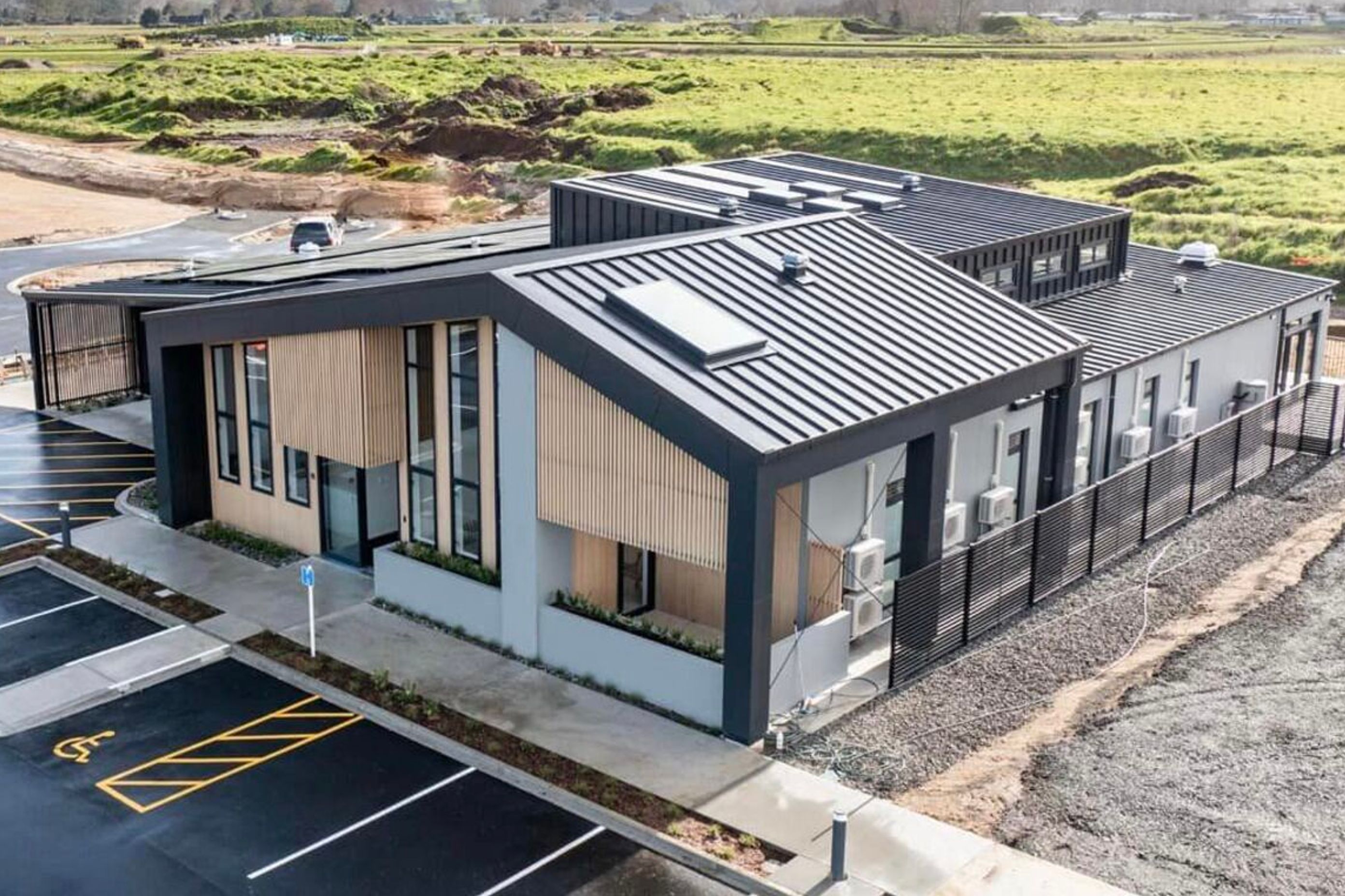 Supply and Installation of Eurostyle Spanlok 45 0.55 450 Nominal Pan (455 cover) Maxx “Flaxpod” roofing and cladding.              Photo Credit Erica Kurth Photography