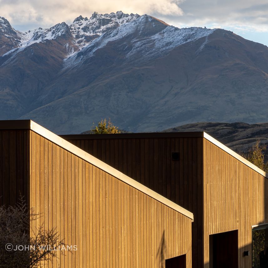 Simple, timber clad monopitch building forms