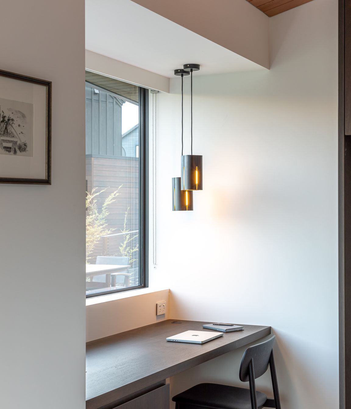 Pendant by Odd Thing Made lights the study space