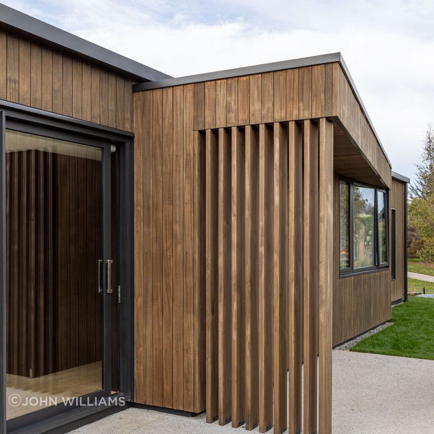 External timber fins and pop-out roof define a family bbq area