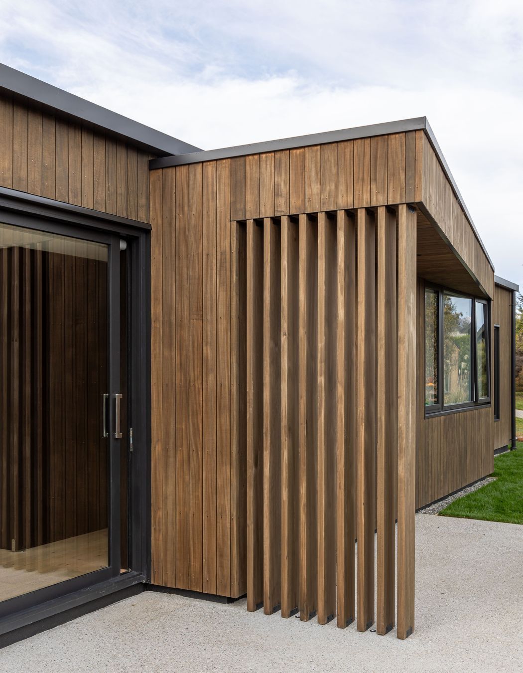 External timber fins and pop-out roof define a family bbq area