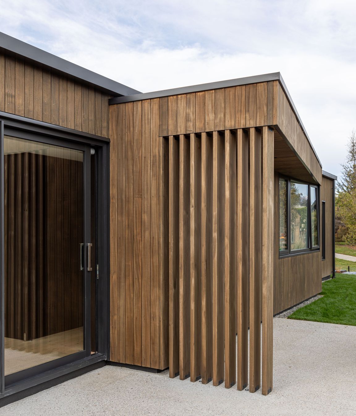 External timber fins and pop-out roof define a family bbq area