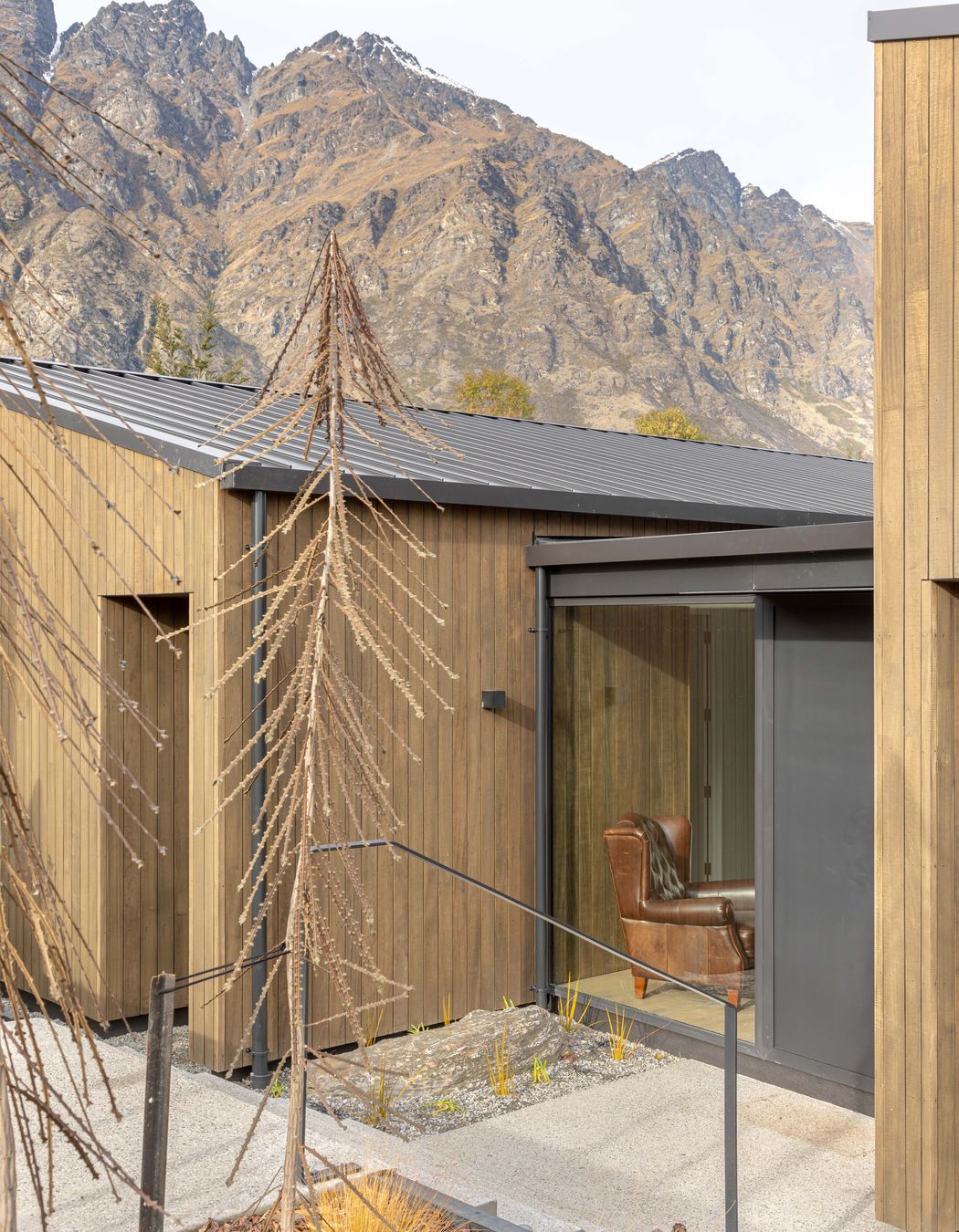 The sloping site steps down towards the main entry