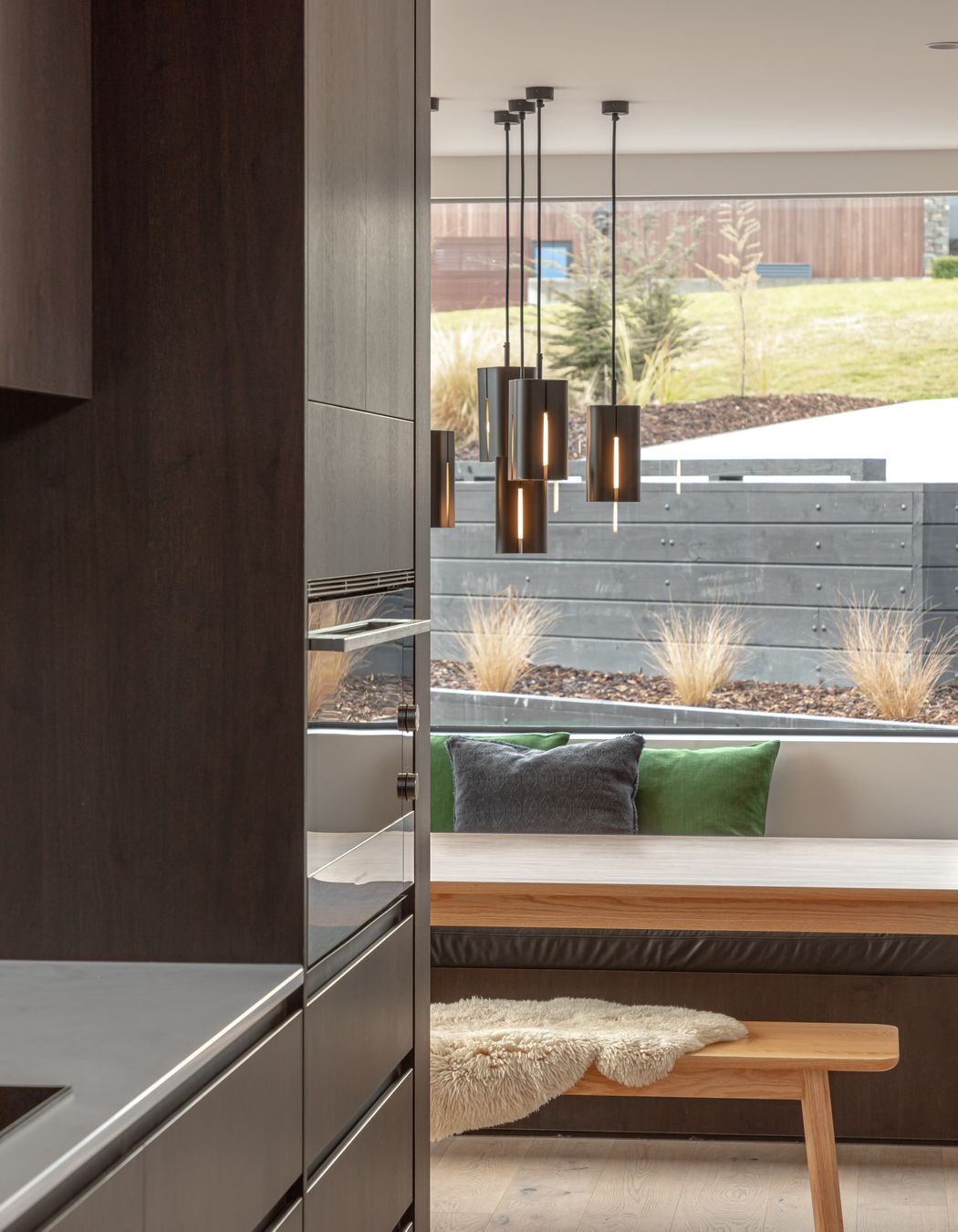 A window seat creates a relaxed but inviting seating and dining area