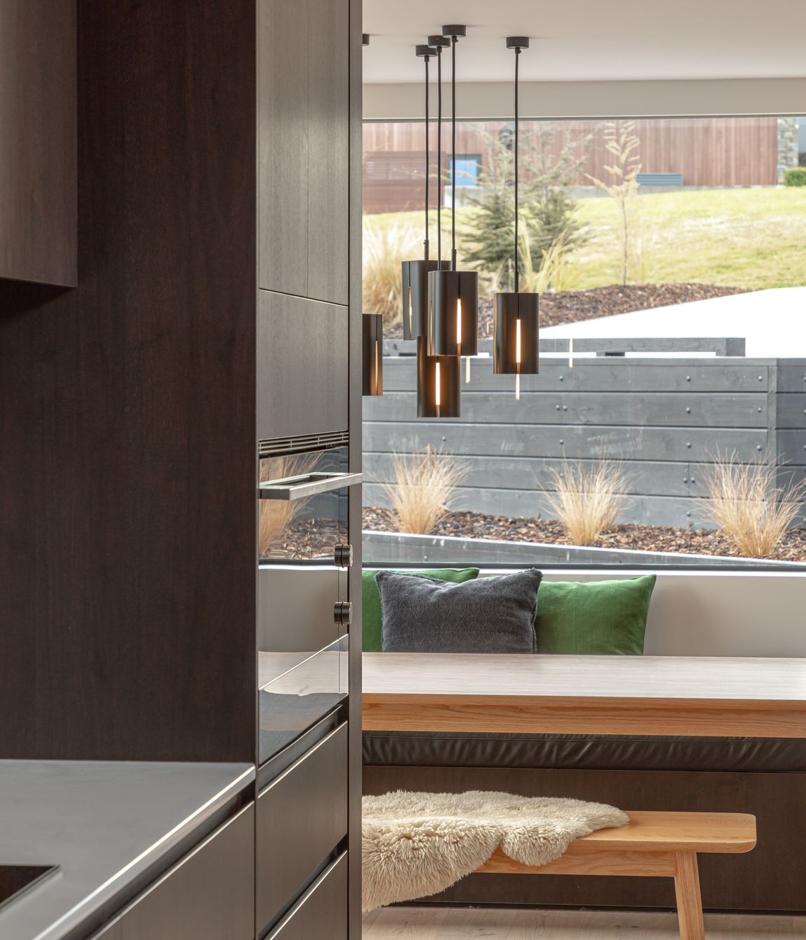A window seat creates a relaxed but inviting seating and dining area