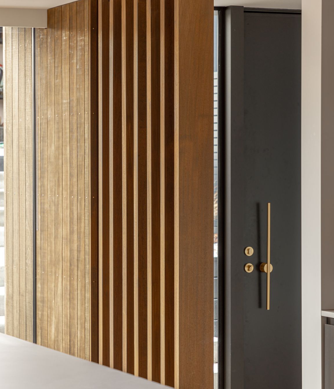 Timber fins separating the entry from the main living areas