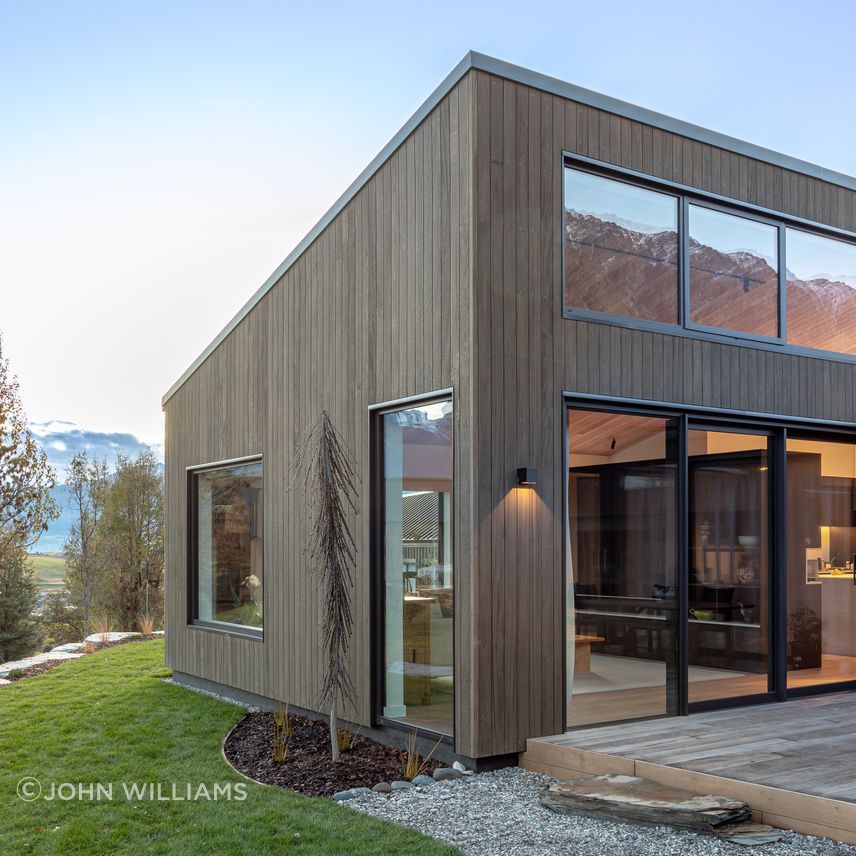 High level windows look up to, and reflect views of the Remarkables mountain range