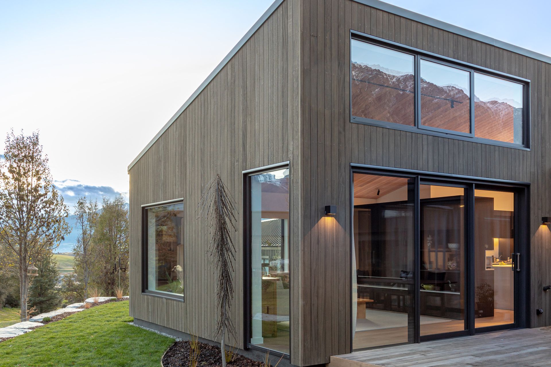 High level windows look up to, and reflect views of the Remarkables mountain range