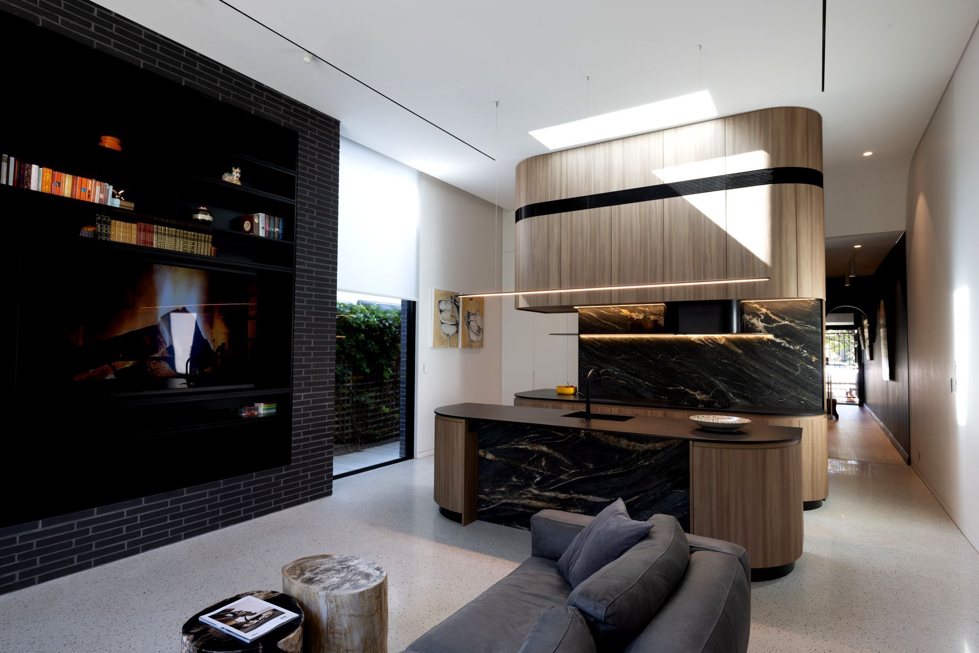 Kitchen and Black brick wall forming key elements of the new extension. A black hallway leads into the original part of the house