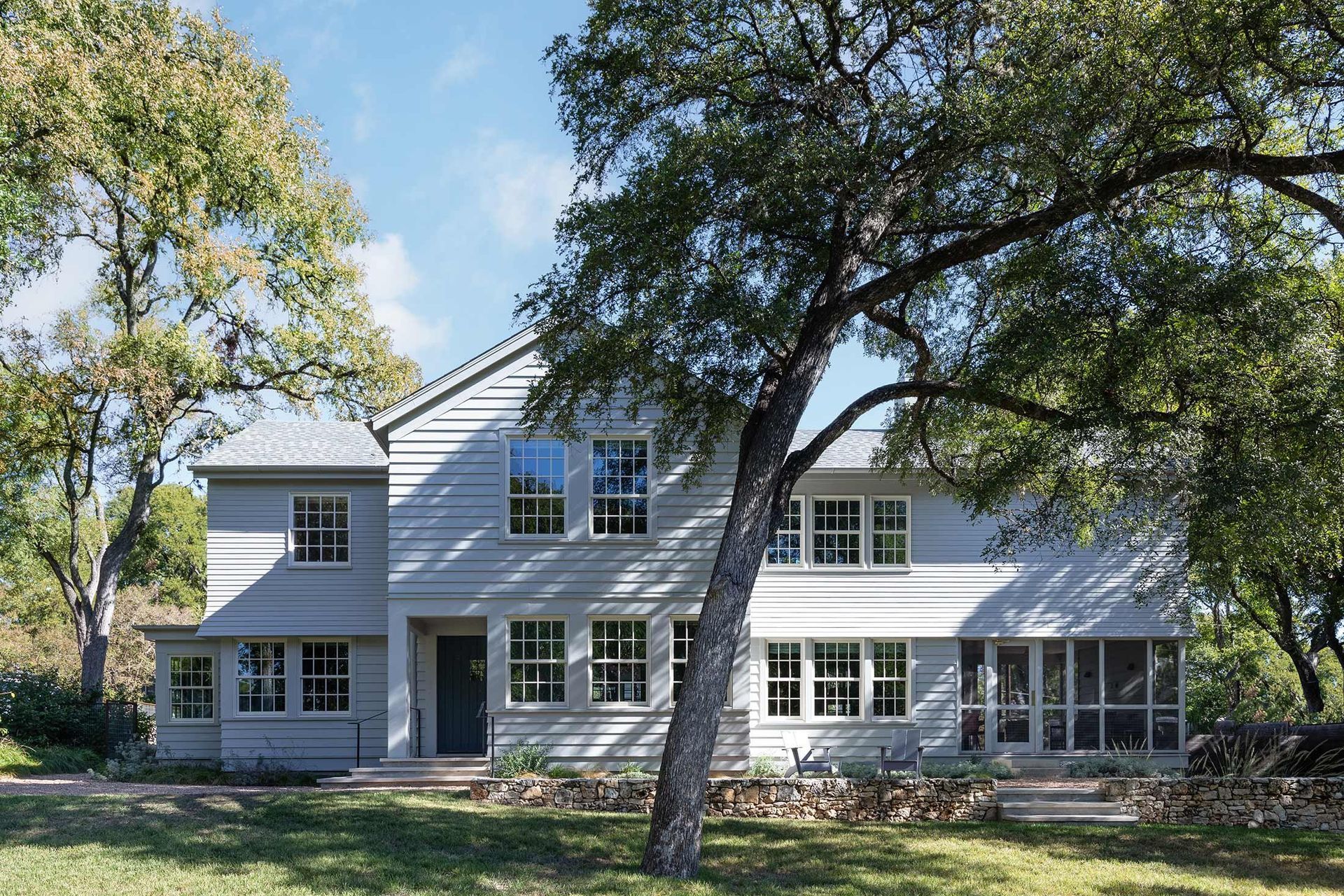 2GriswoldCuppettKilpatrickArchitectureandInteriorDesignaustin-tx-suburban-home-lap-siding-oak-trees.jpg
