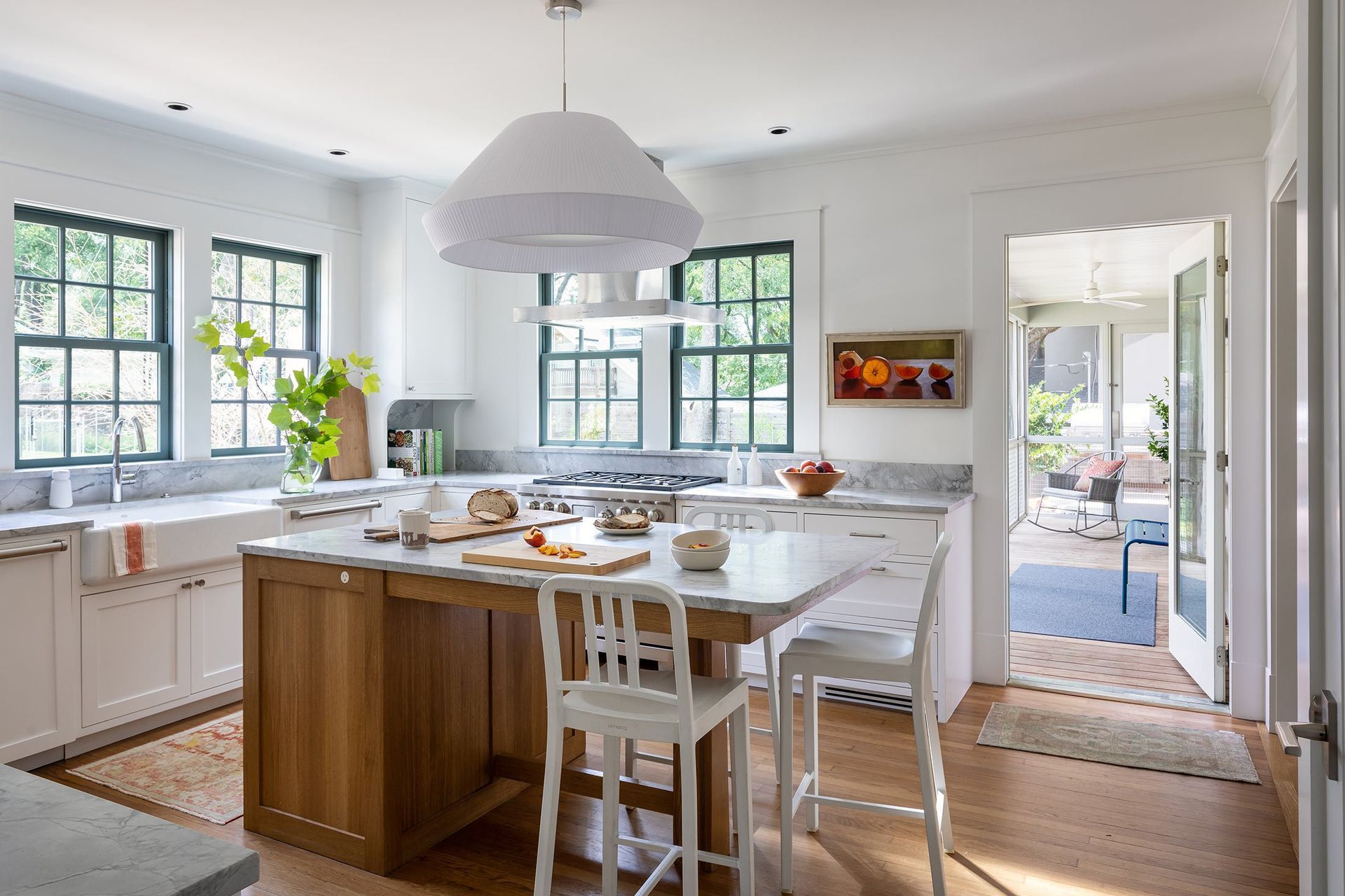 5GriswoldCuppettKilpatrickArchitectureandInteriorDesignaustin-tx-kitchen-marble-island-wood-bright.jpg