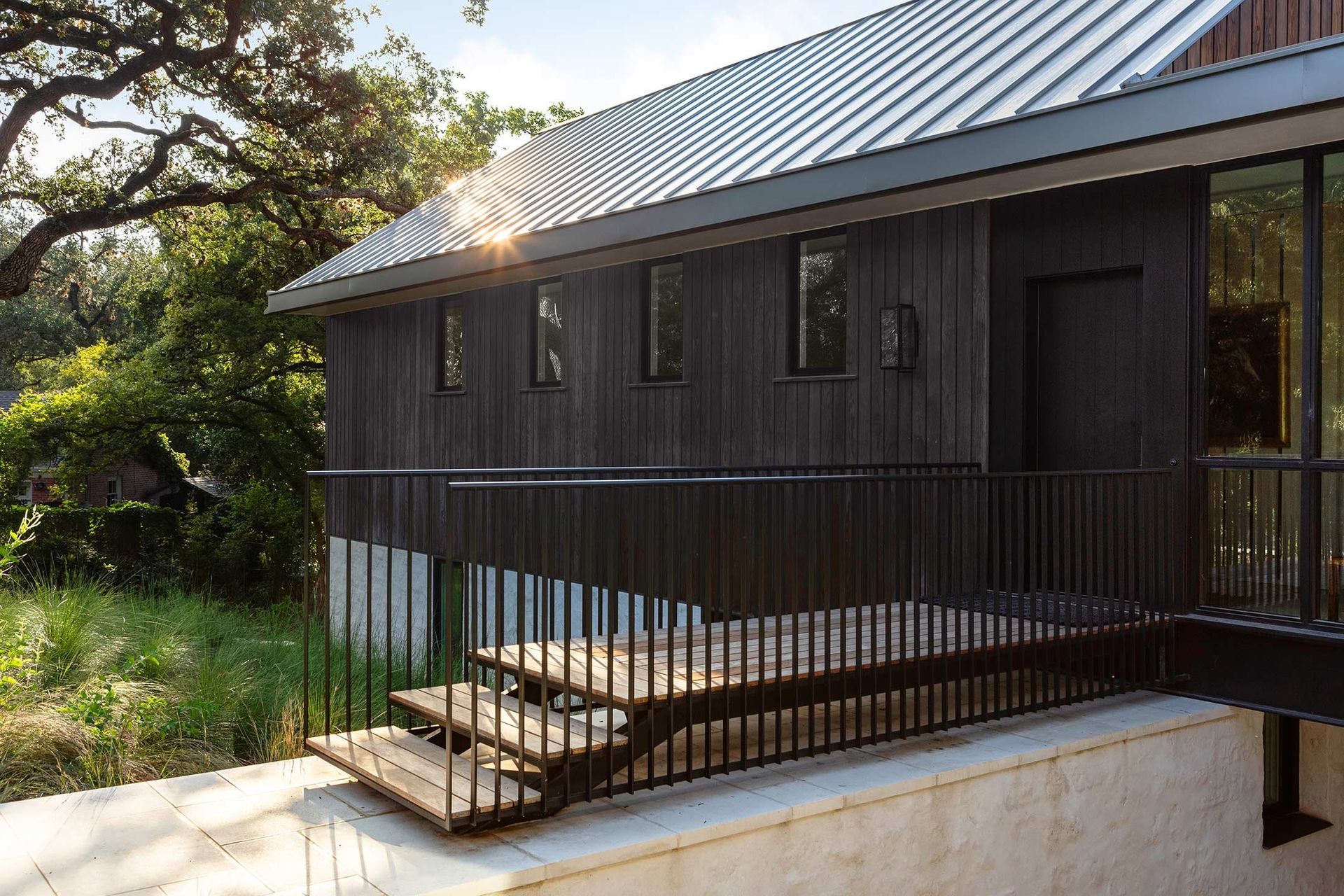 6BelmontParkCuppettKilpatrickArchitectureandInteriorDesignaustin-tx-modern-wooden-walkway-metal-railing.jpg