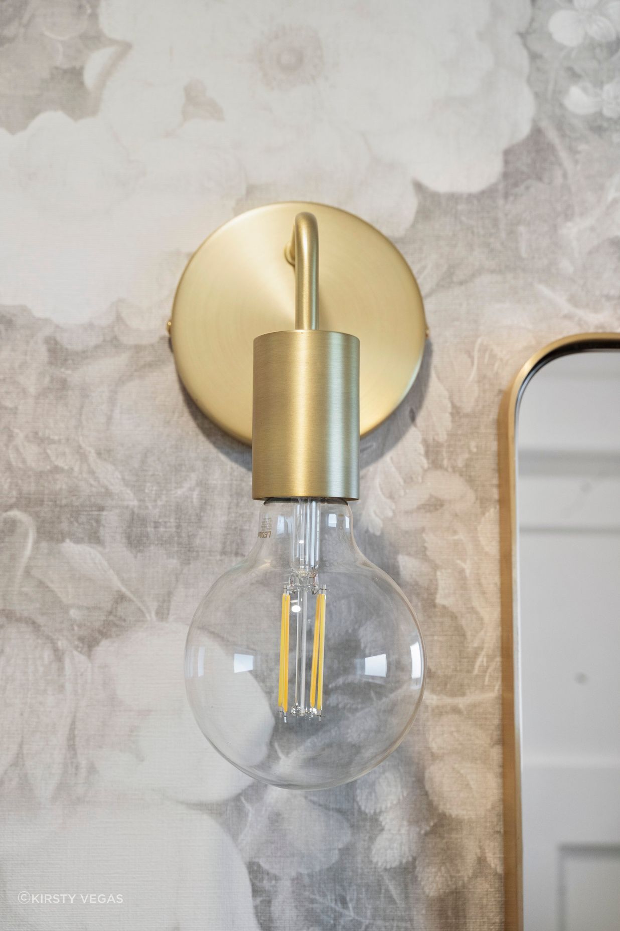The gentle, curved lines of the brushed brass accents seamlessly blend into the overall design of the space, adding a touch of elegance and sophistication. These soft contours complement the existing elements, creating a harmonious interplay of textures and finishes. The refined brass detailing not only enhances the aesthetic but also invites warmth, making the room feel inviting and beautifully cohesive.