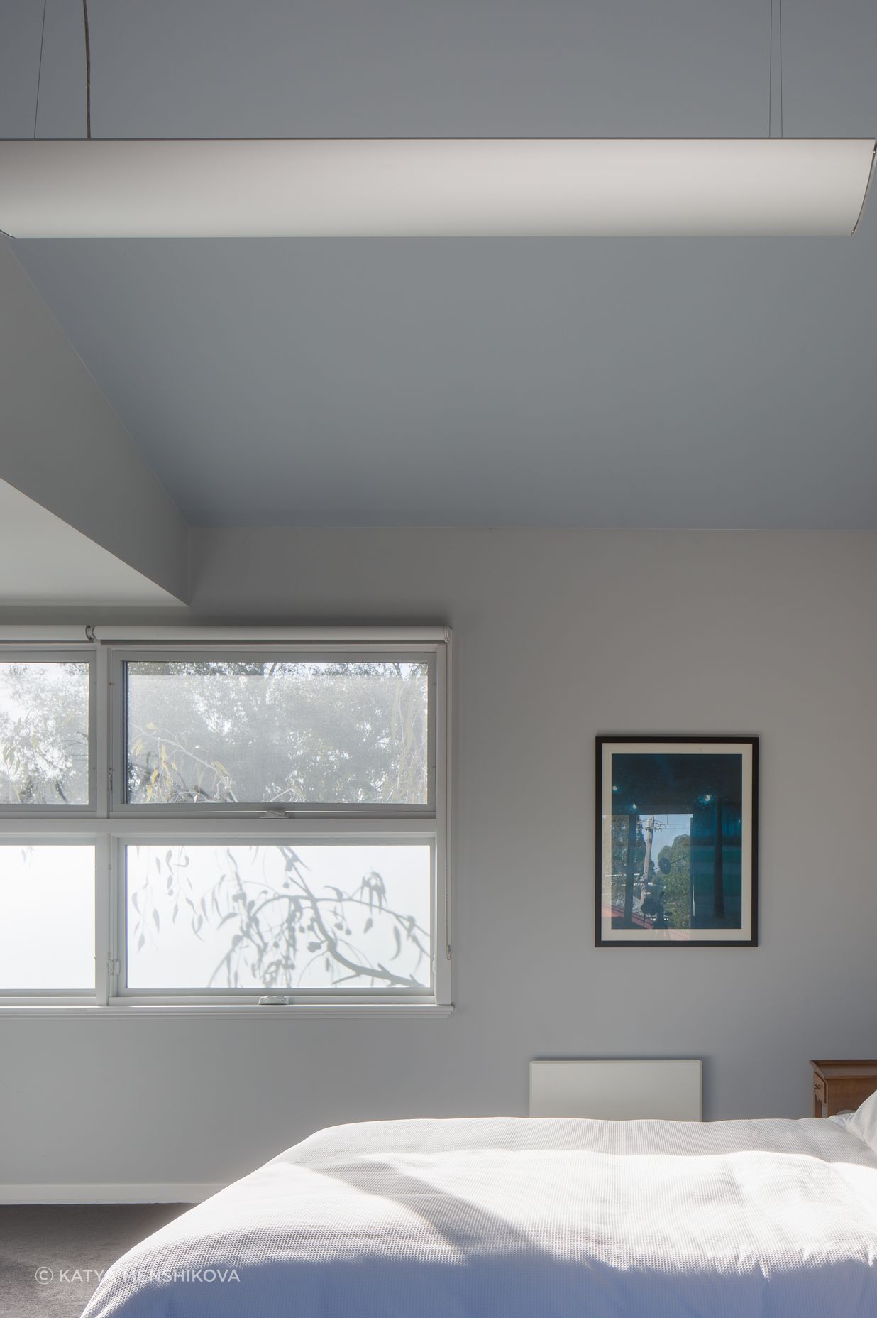 Frosted glass brings in light and shadows from the native gums, while allowing for privacy in the upstairs bedroom.