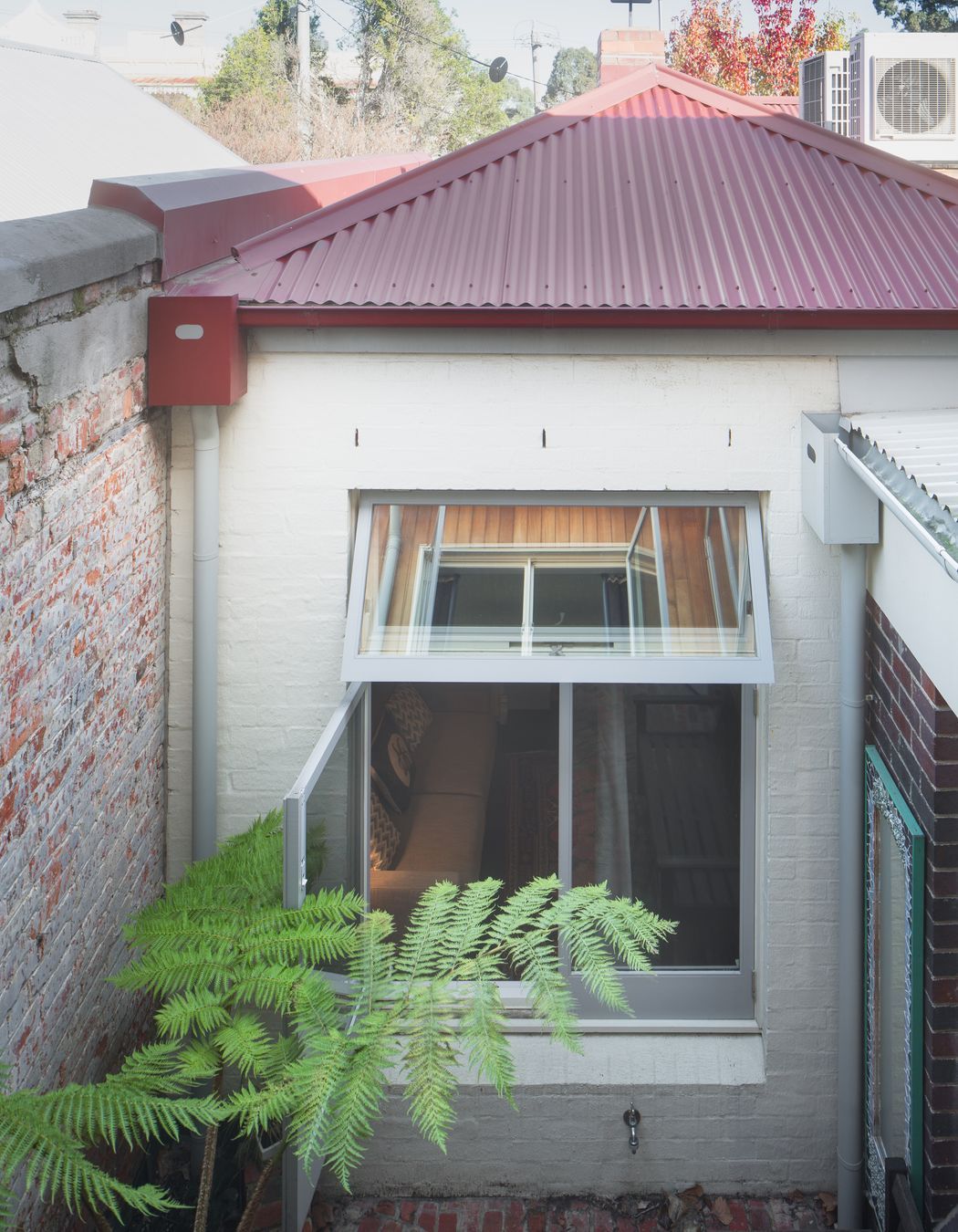 Second miniature courtyard acts as a light well and seating area.