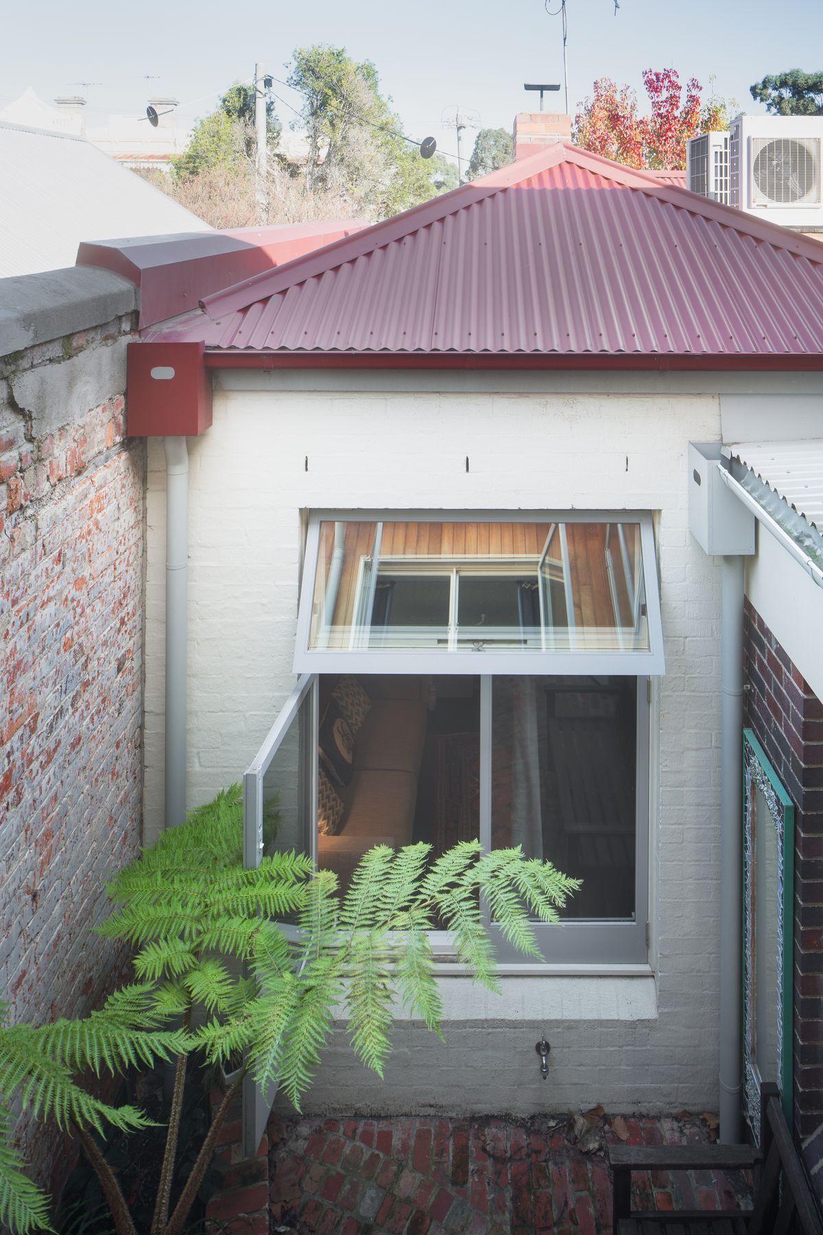 Second miniature courtyard acts as a light well and seating area.