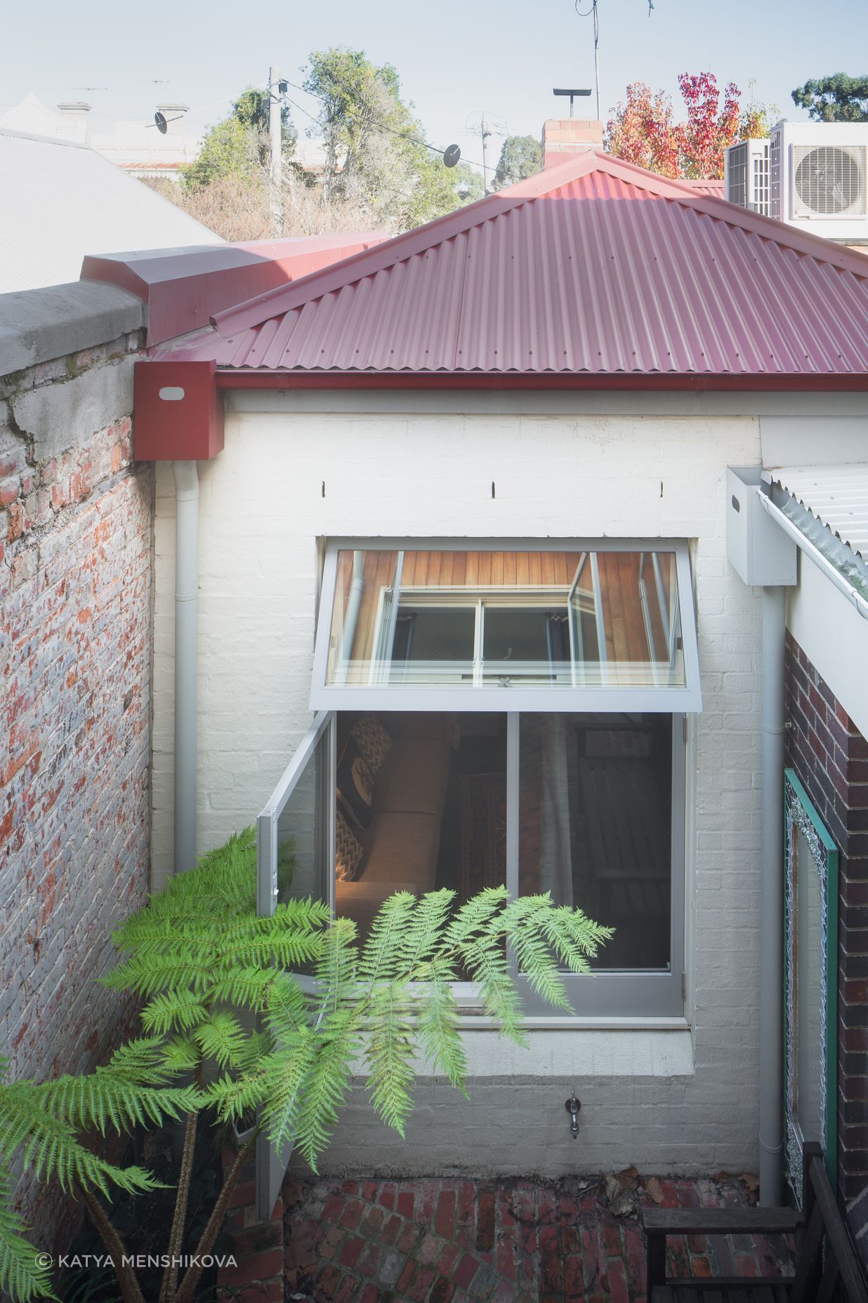 Second miniature courtyard acts as a light well and seating area.