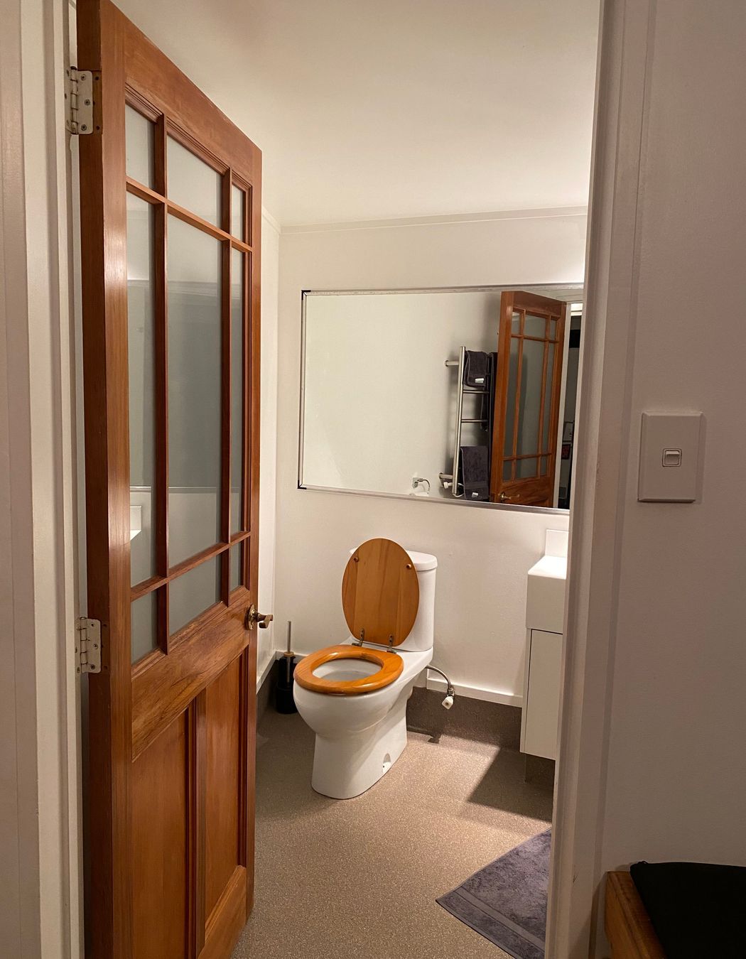 The outdated bathroom, now transformed into a sleek and contemporary modern space.