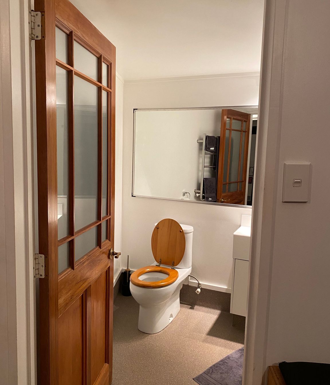 The outdated bathroom, now transformed into a sleek and contemporary modern space.