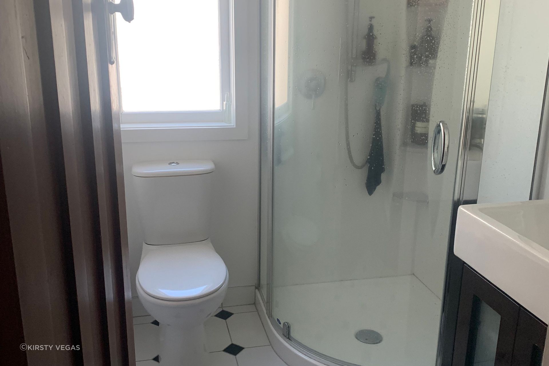 Before the renovation, the main bathroom was noticeably small and had a dated appearance that limited its functionality and aesthetic appeal. The existing layout constrained movement and made it feel even more confined. However, by repositioning the window and extending into the hallway, we created valuable additional space. This strategic alteration allowed for the integration of larger shower and vanity areas, transforming the bathroom into a more comfortable and inviting environment, ready for a modern makeover.