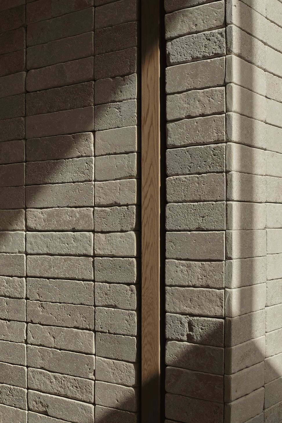 Creamy Pendell batons clad interior and exterior walls to provide linear contrast and form two feature chimney walls, uniting the home with visually rich tactility. The small format limestone was chosen for its supple texture, smooth finish and dimensional accuracy.