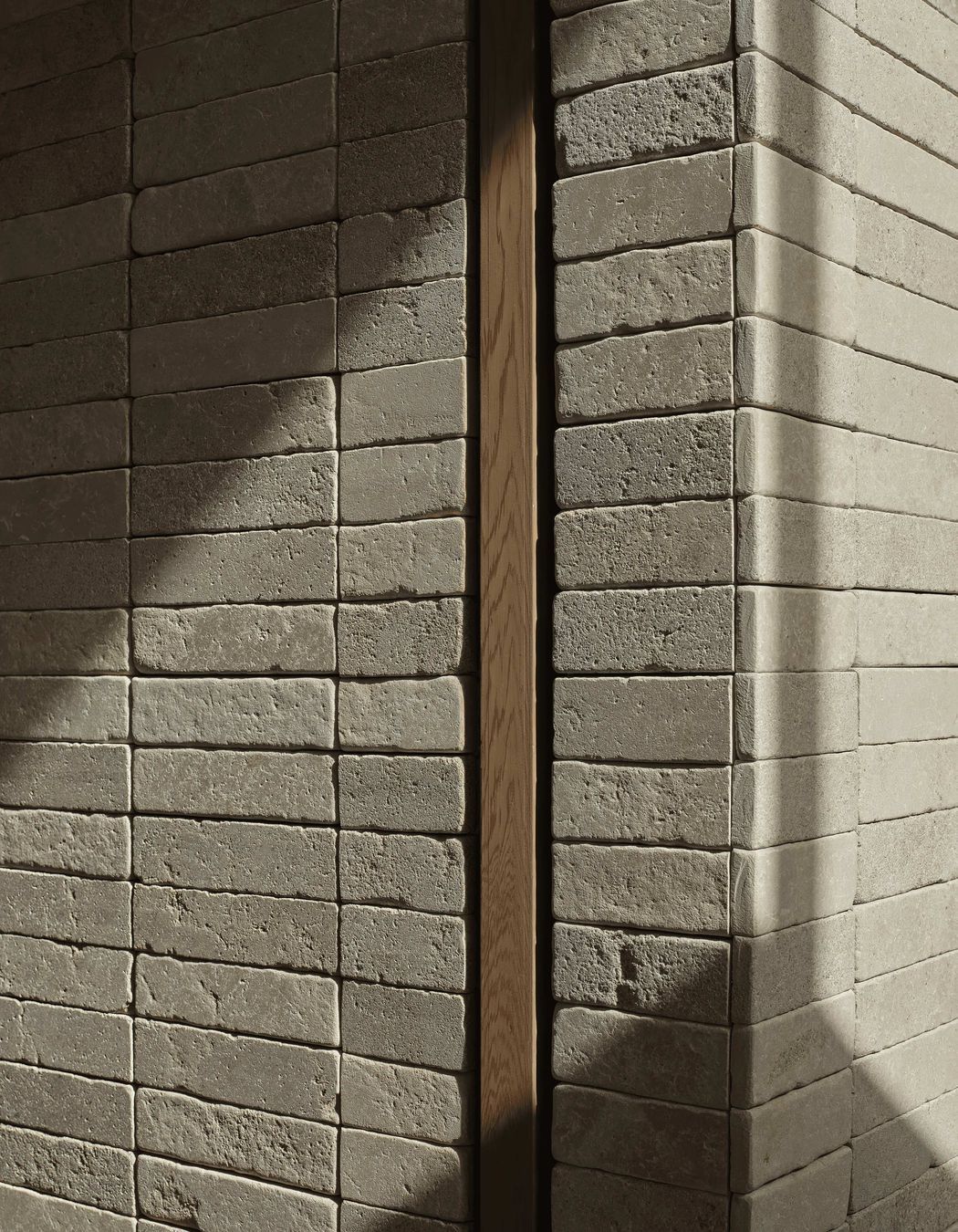 Creamy Pendell batons clad interior and exterior walls to provide linear contrast and form two feature chimney walls, uniting the home with visually rich tactility. The small format limestone was chosen for its supple texture, smooth finish and dimensional accuracy.
