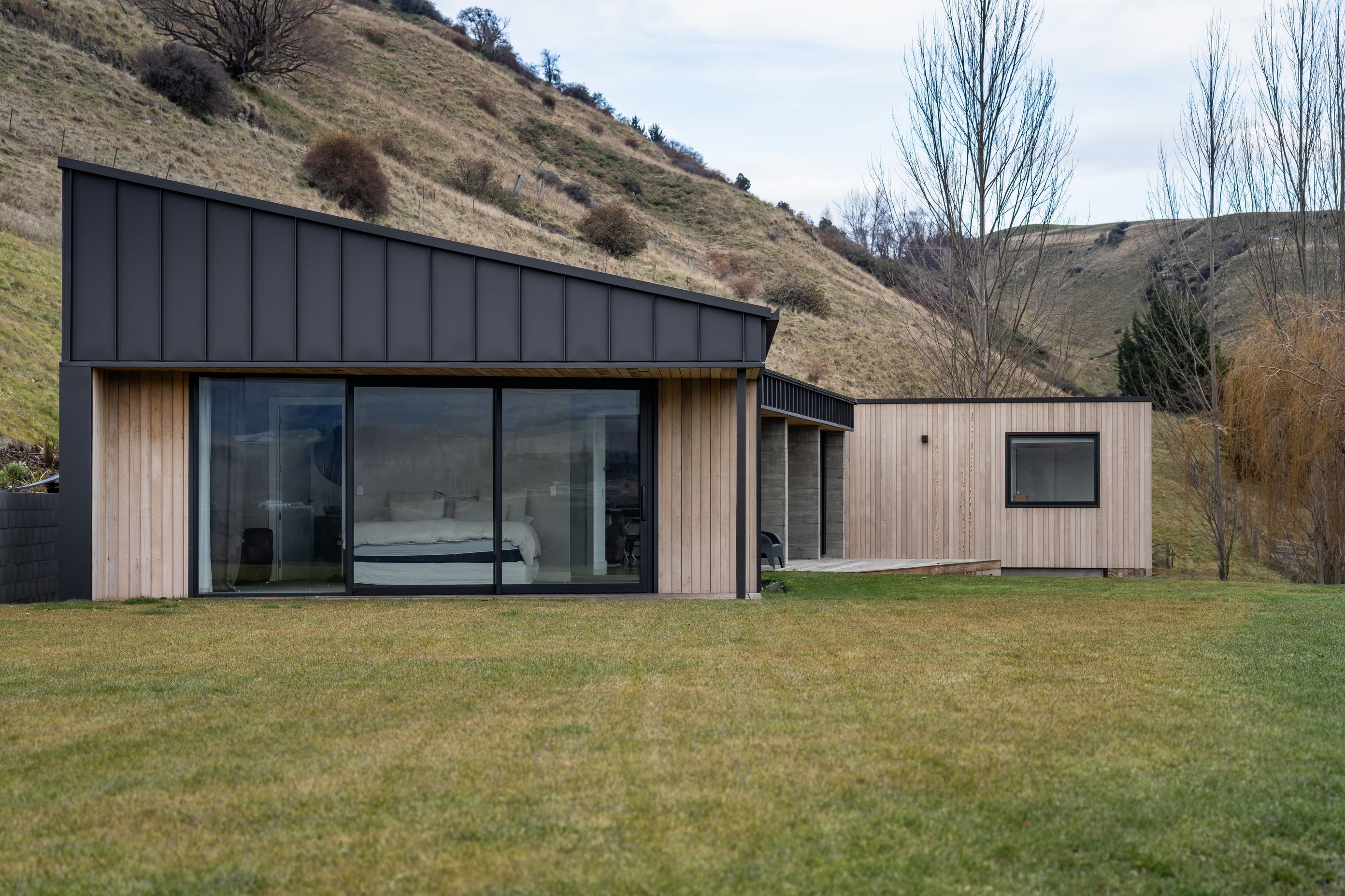 The form follows the contours of the adjacent hillside