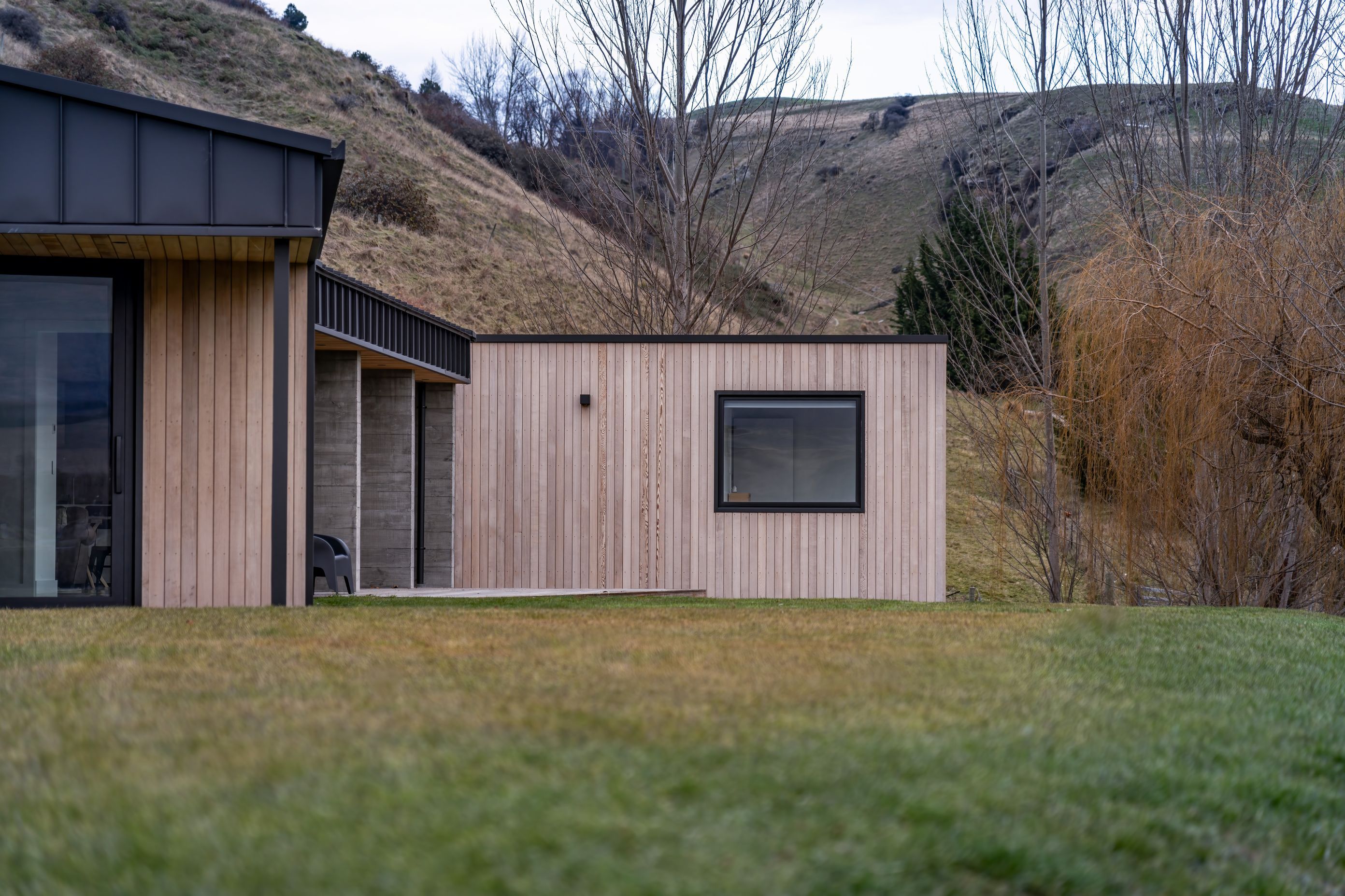 Form and materials have been designed to integrate with the home's surroundings
