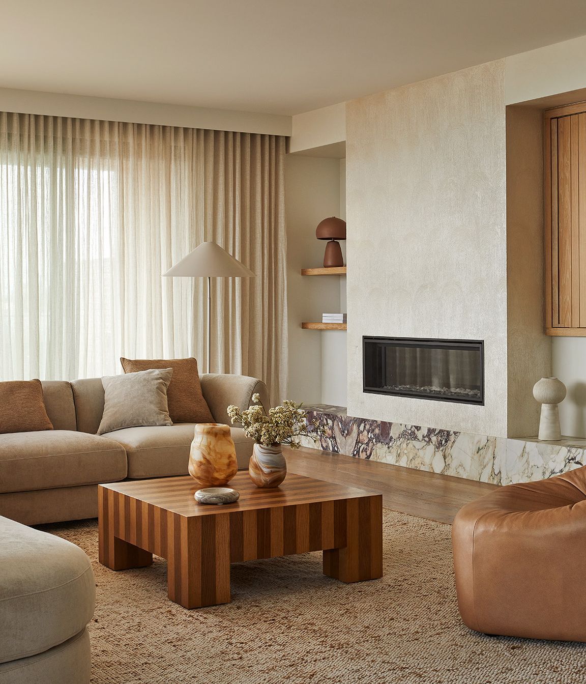 Pictured: Natadora Arbor Sofa Chair, Reese Square Coffee Table, Hanson Spire Vessel, Rufus Indra Shallow Bowl, Boden Perry Vase, Easton Shelter Floor Lamp, Easton Arch Table Lamp, Madrid Modular Sofa