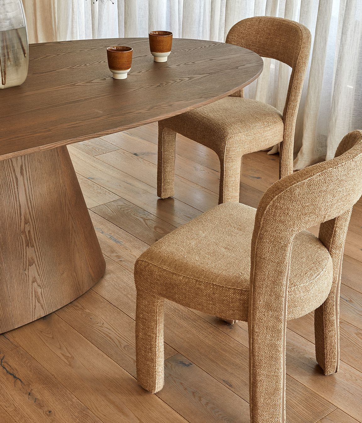 Pictured: Eleanor Dining Chair, Classique Oval Dining Table, Boden Ridge Vase