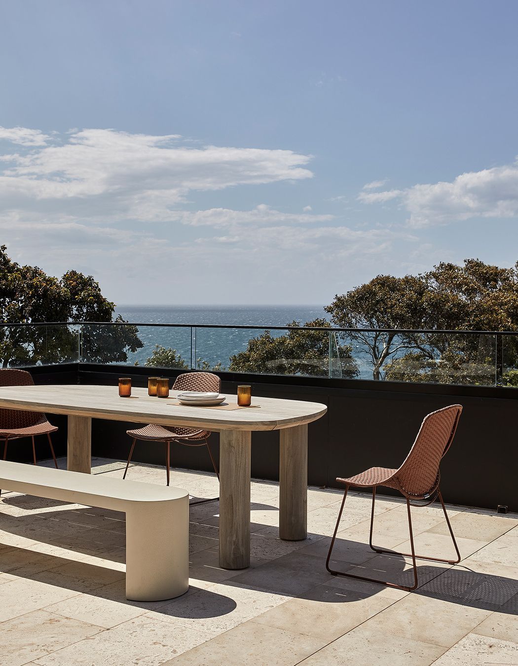 Pictured: Seb Outdoor Dining Table, Petra Bench, Corsica Scoop Dining Chair