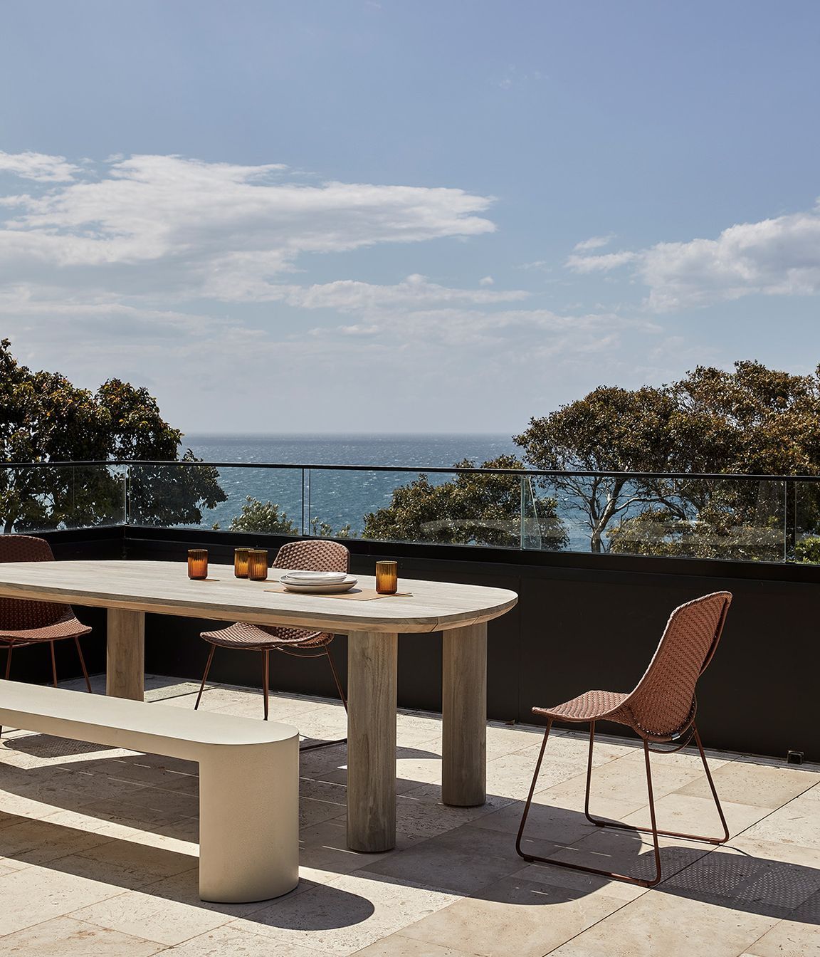 Pictured: Seb Outdoor Dining Table, Petra Bench, Corsica Scoop Dining Chair