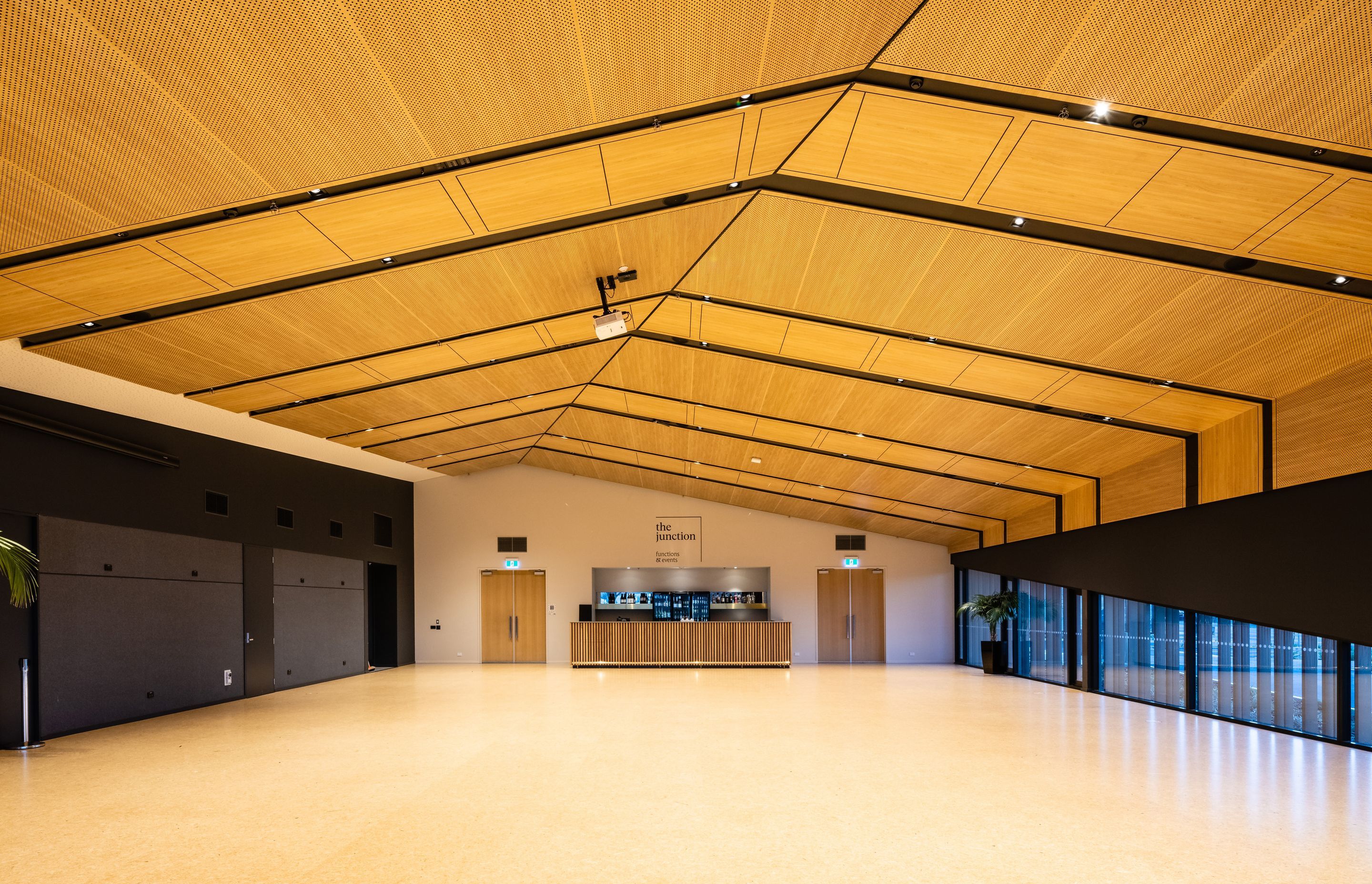 A two-way suspended ceilings provides acoustic properties and aesthetics, as well as concealing services for ease of access. Photography by Clinton Lloyd.