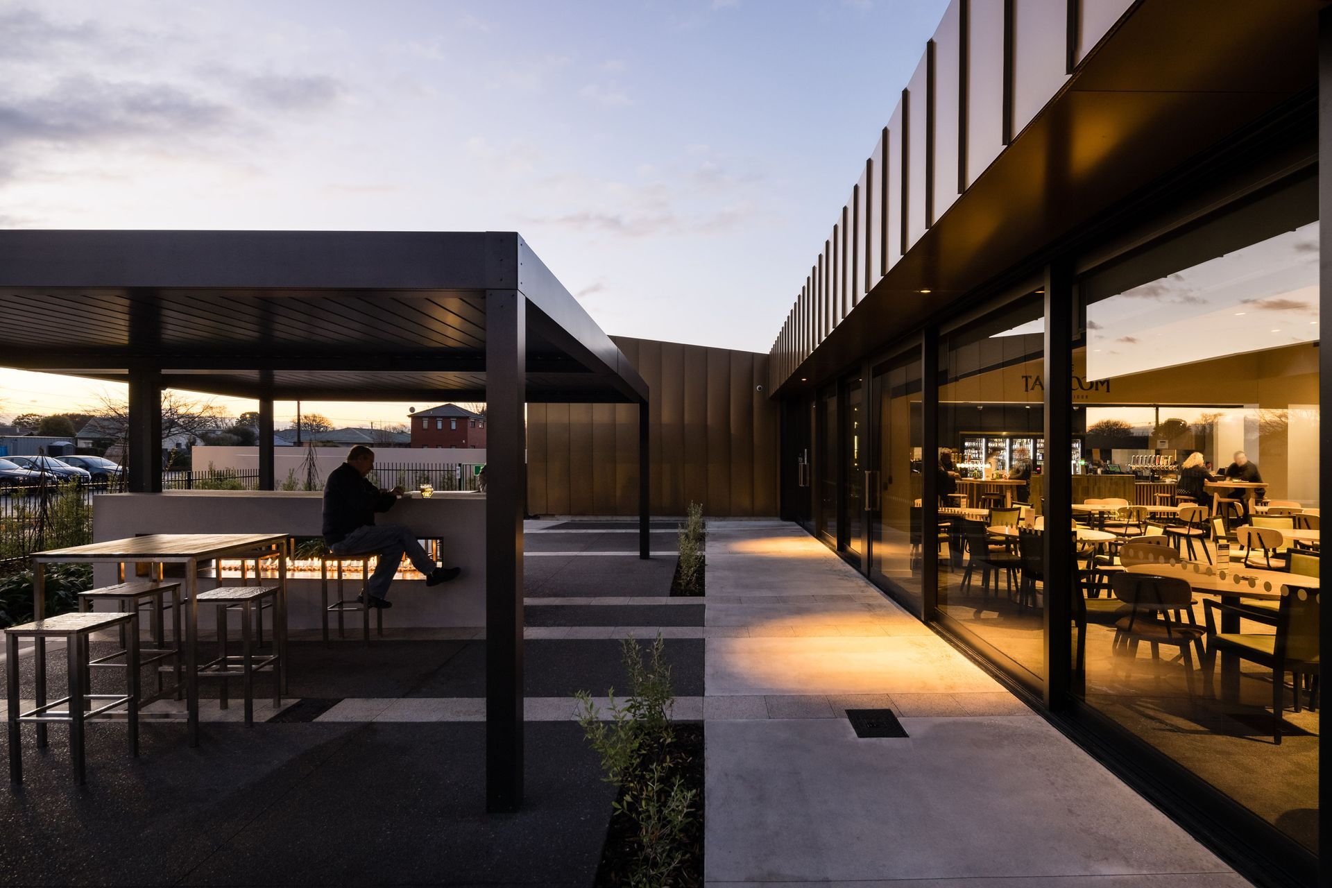 An operable louvre roof and outdoor fireplace mean the terrace is an inviting space that can be used year-round. Photography by Clinton Lloyd.