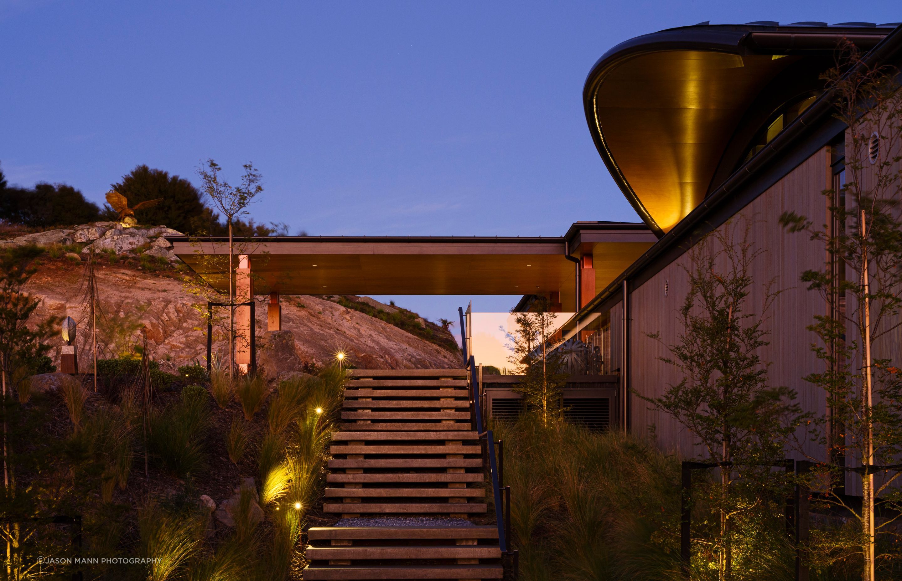 Lighting, like the rest of the landscaping, has been kept minimal so as not to detract from the natural surroundings or the bold architectural detailing of the building.