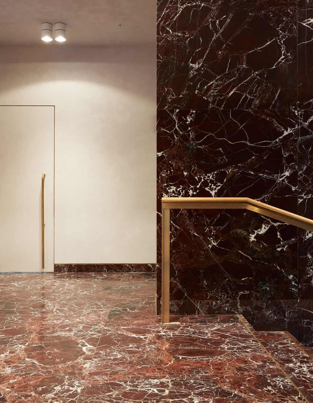  “RJH always has artwork in the lobby of its buildings, and music playing.” The stone is rosso levante marble.