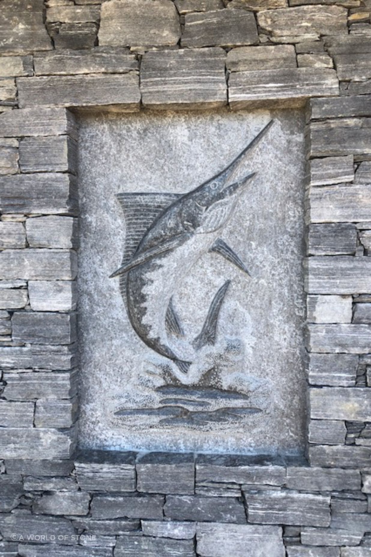 Carved marlin by A World Of Stone Ltd in West Coast Schist