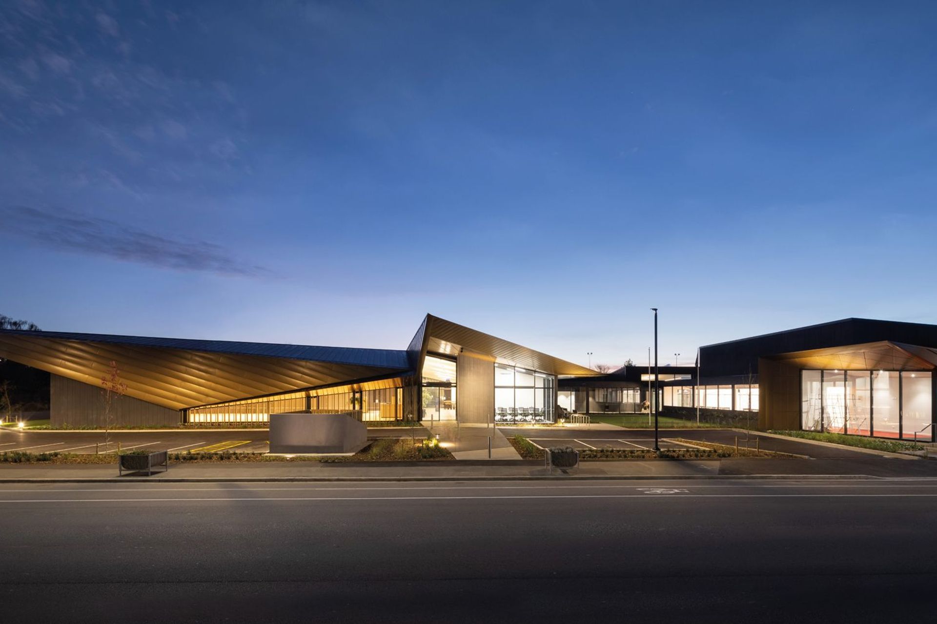 The vision for the refurbished club was for a multipurpose building incorporating the existing building (one that was initially built to replace the damaged building) and a large new build structure. Photography by Clinton Lloyd.