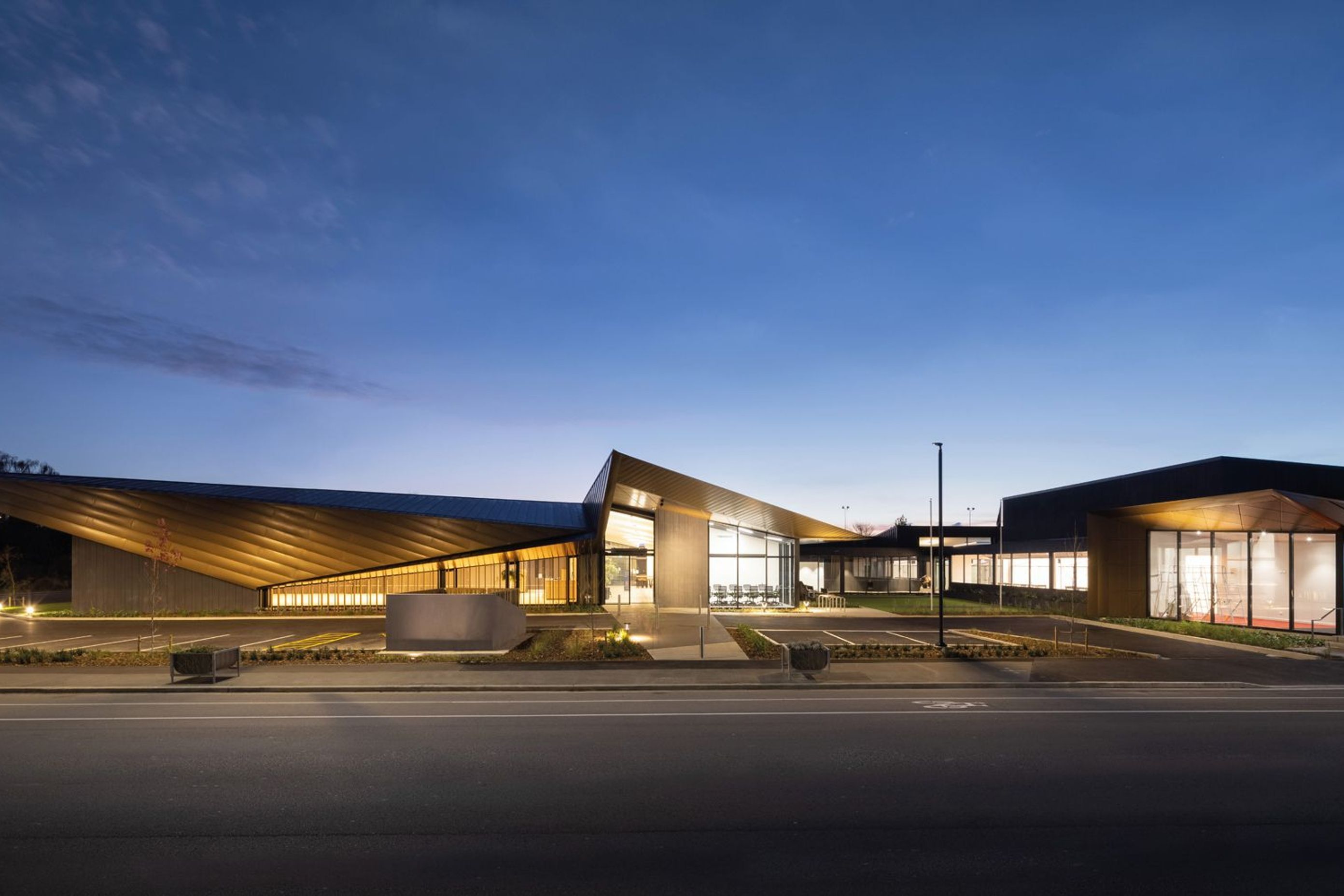 The vision for the refurbished club was for a multipurpose building incorporating the existing building (one that was initially built to replace the damaged building) and a large new build structure. Photography by Clinton Lloyd.