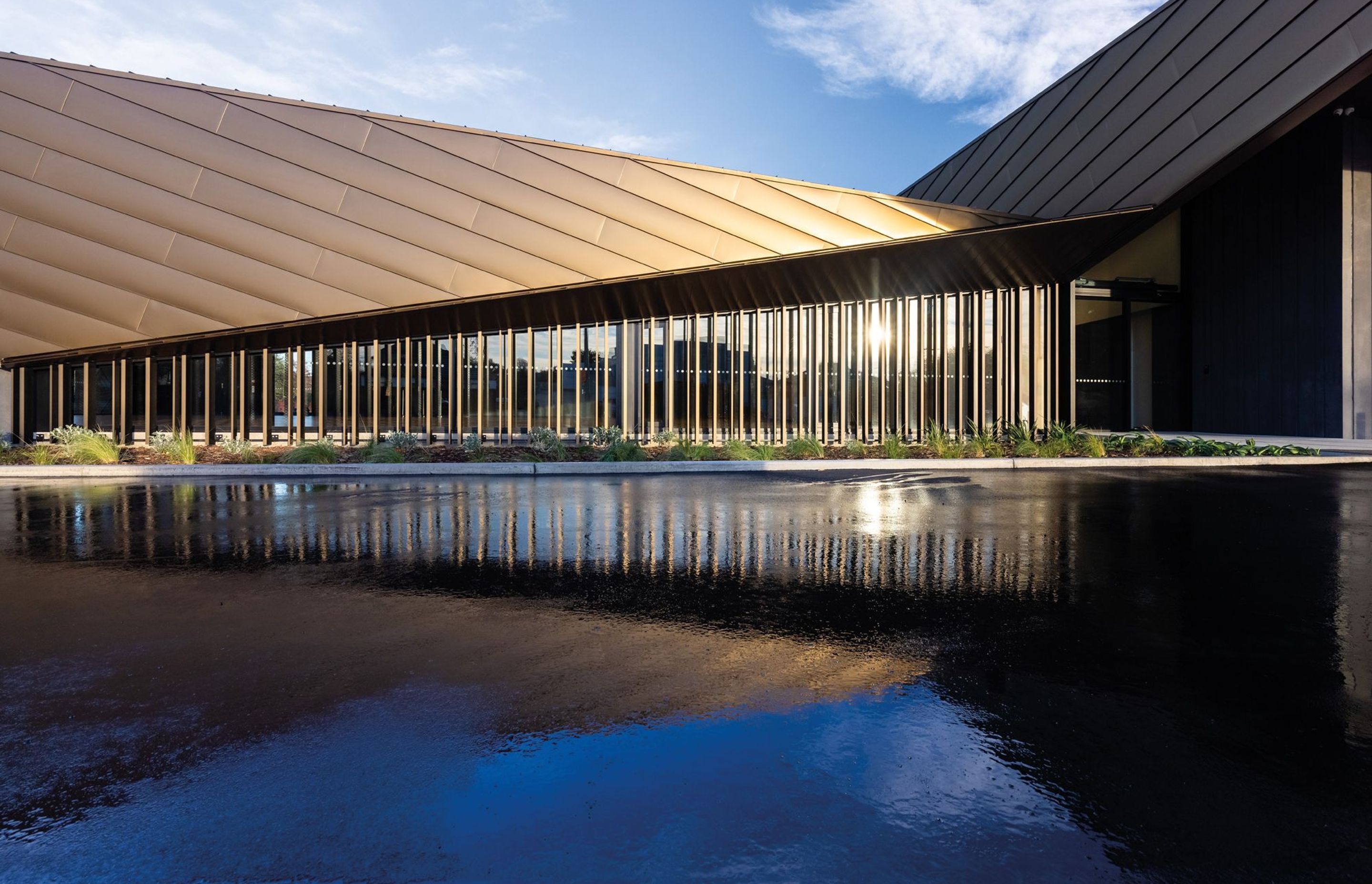 To match the striking architecture, aluminium composite panels in a bronze finish were specified for the roof and cladding. Photography by Clinton Lloyd.