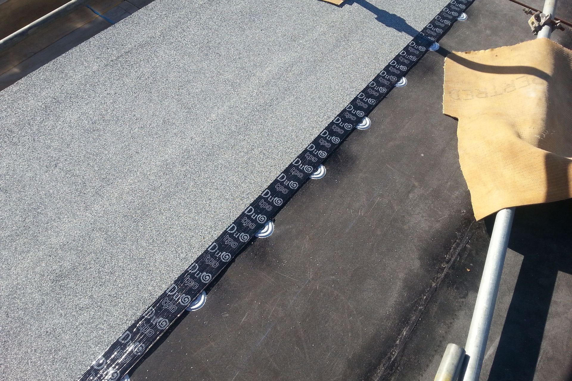 Installation of Duotherm Warm Roof - waterproofing membrane over thermal insulation
