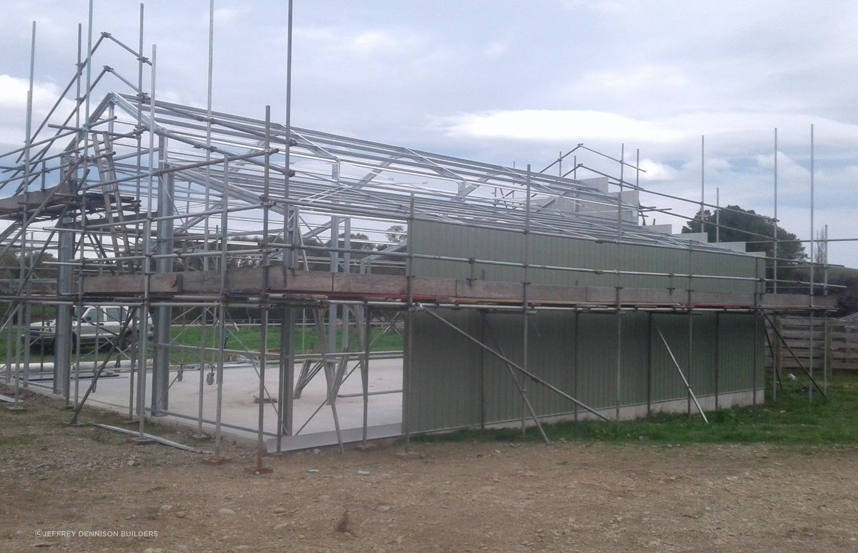 Cladding being erected on one of the sides