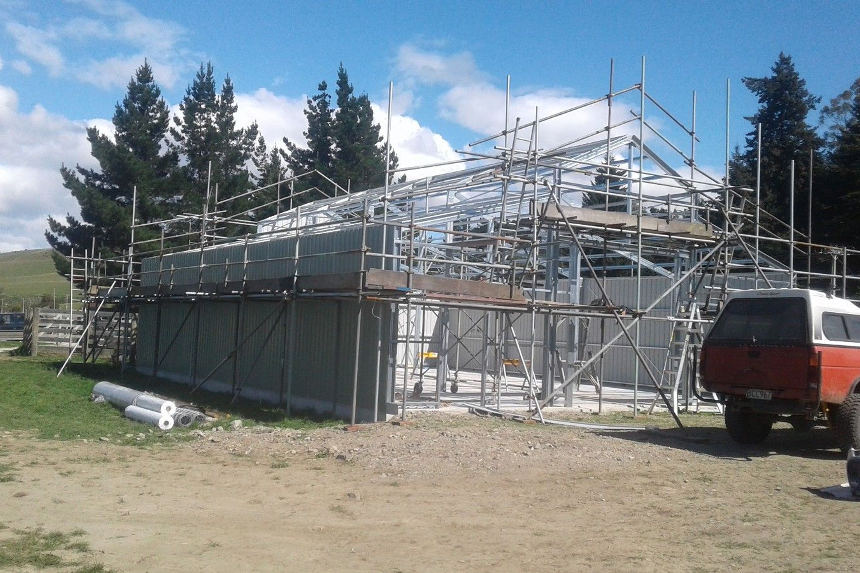 Cladding being erected on the other side of the three bay shed