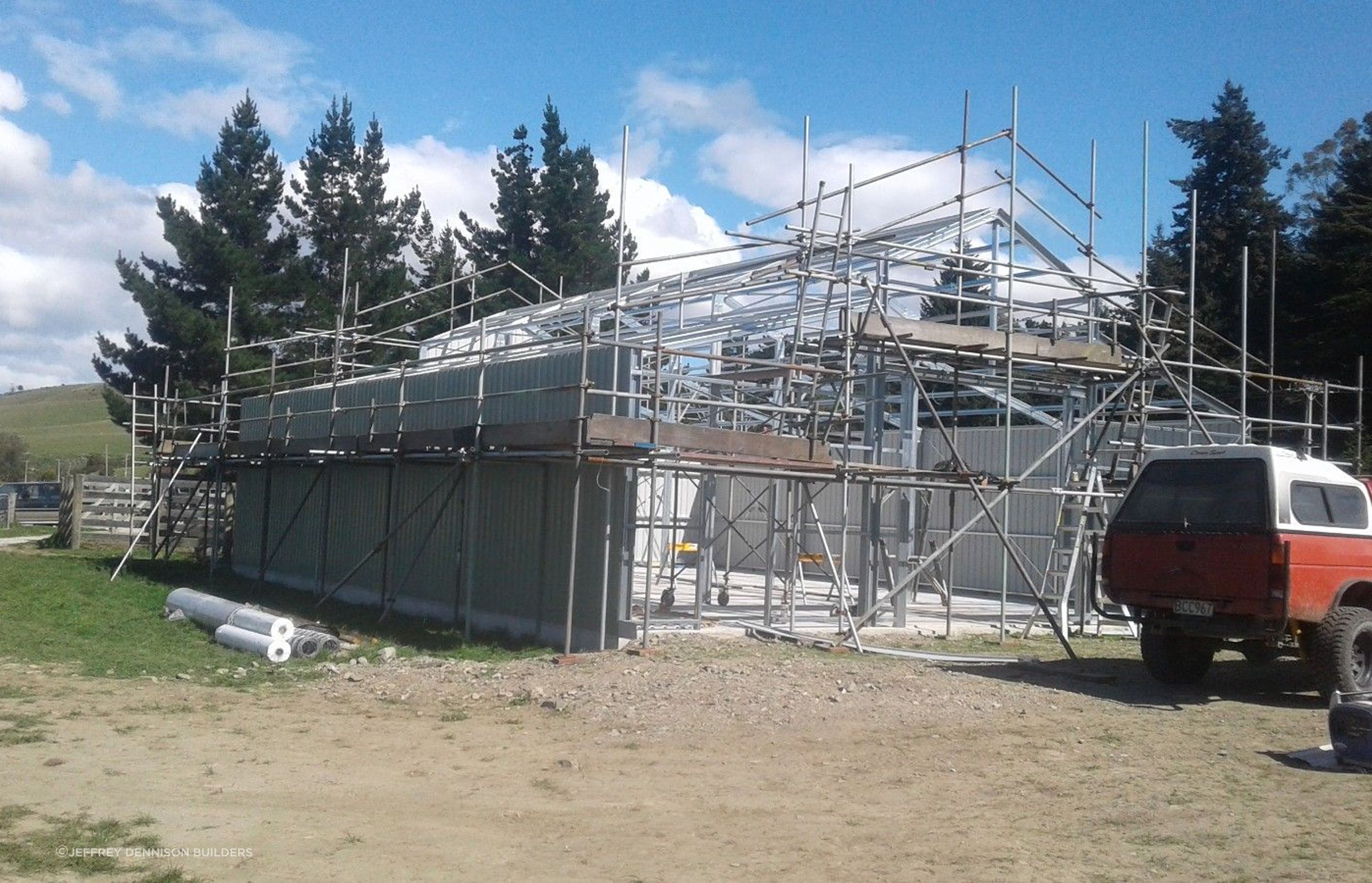 Cladding being erected on the other side of the three bay shed