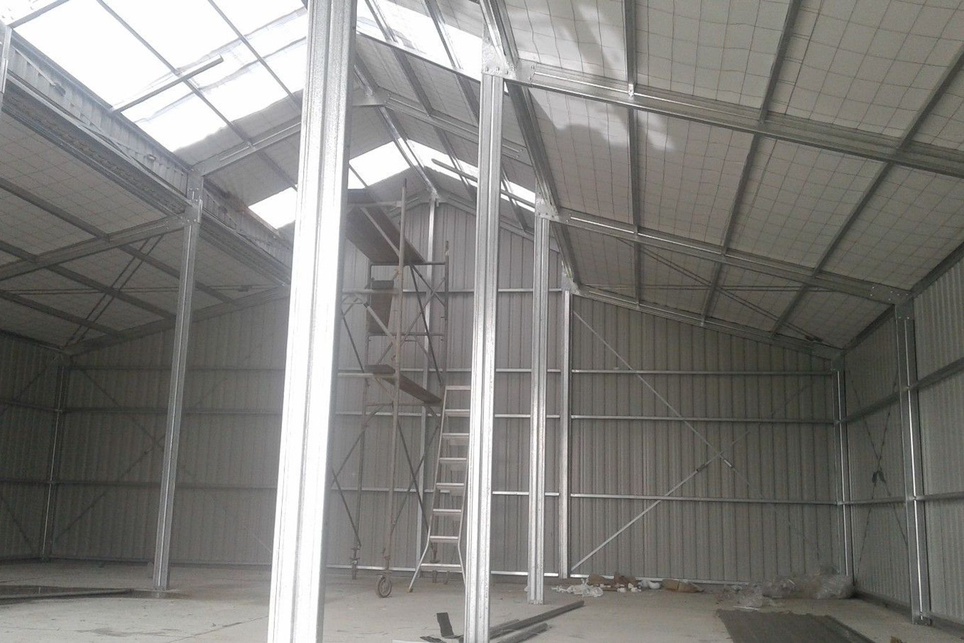 View from within the three bay shed looking up to the roof