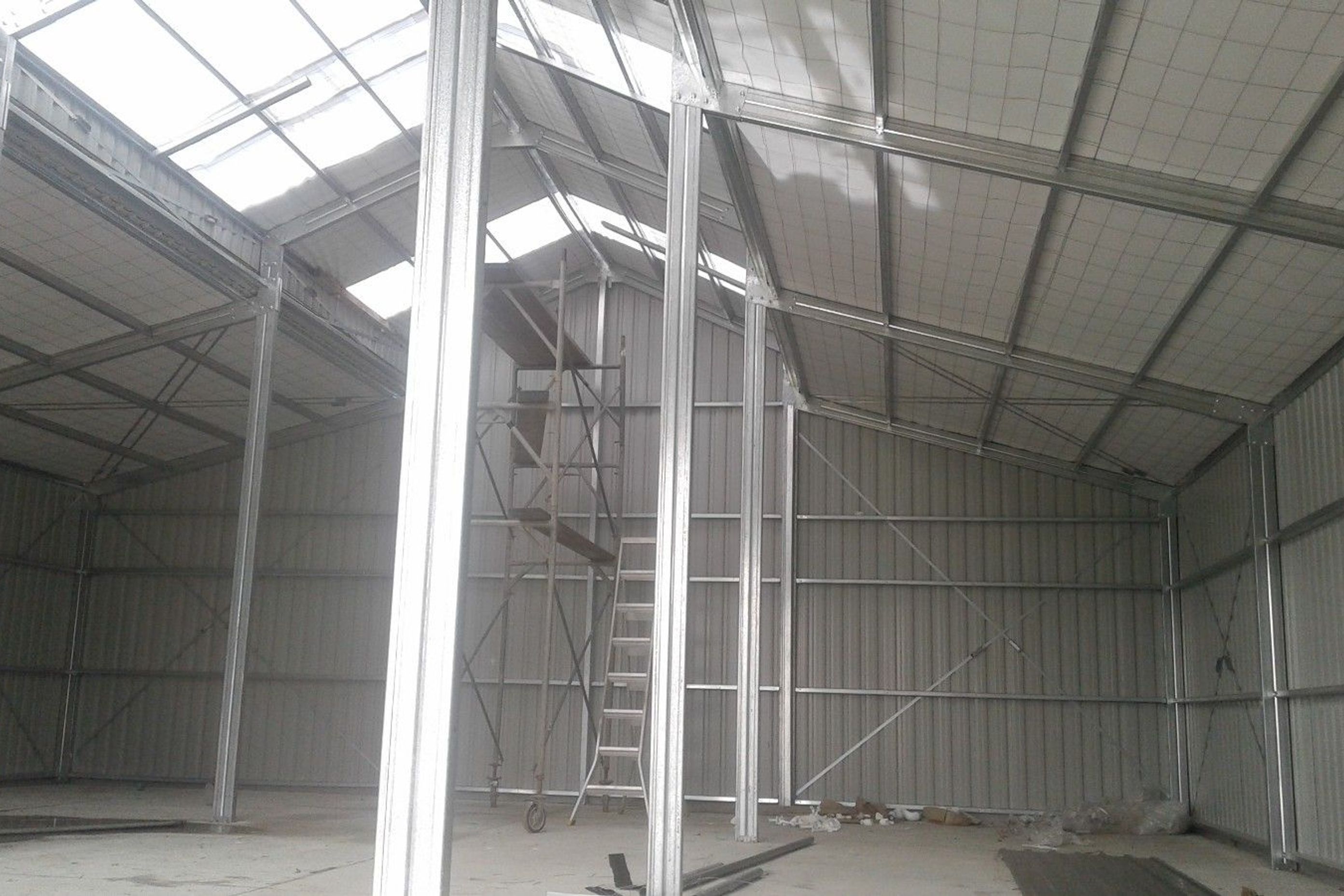 View from within the three bay shed looking up to the roof