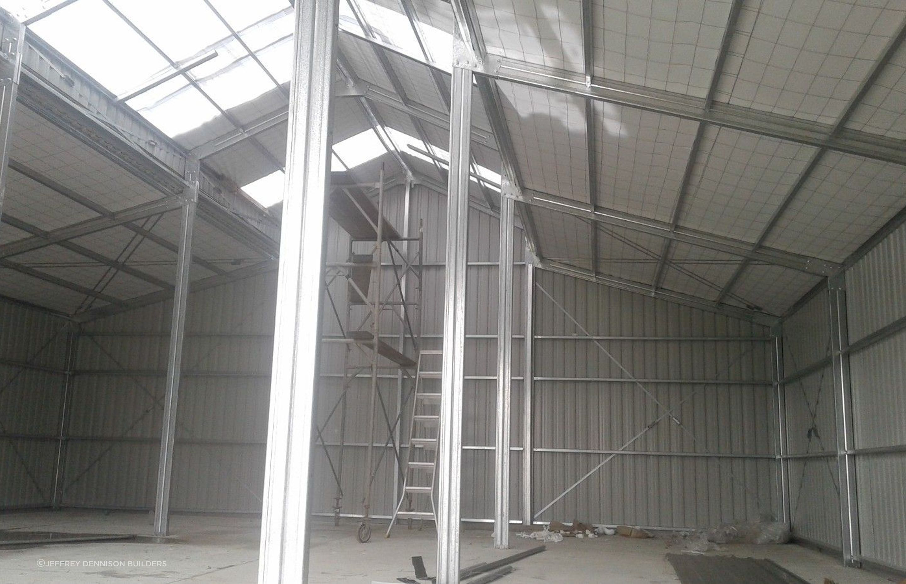 View from within the three bay shed looking up to the roof