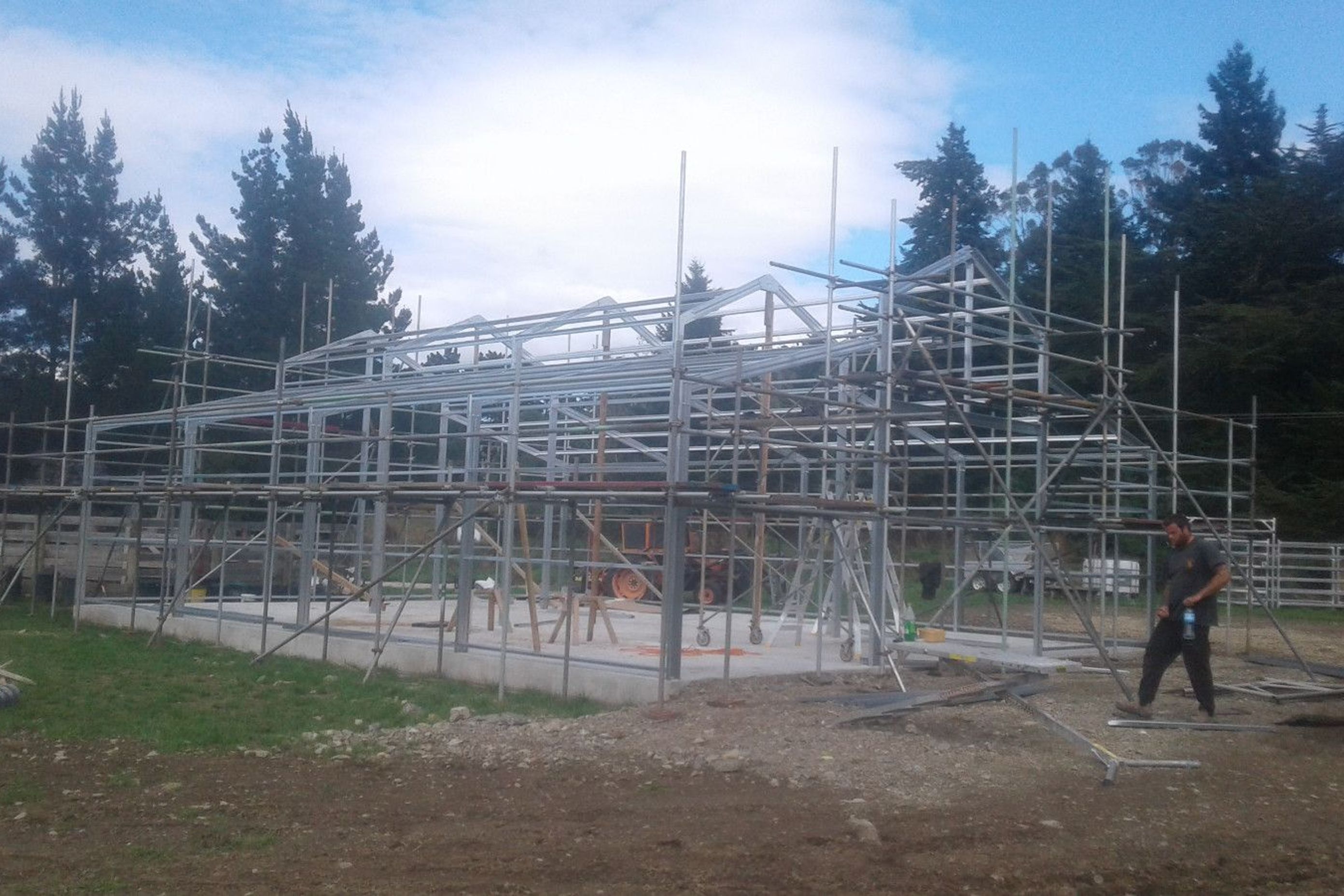 Scaffolding being erected, steel framing making progress.
